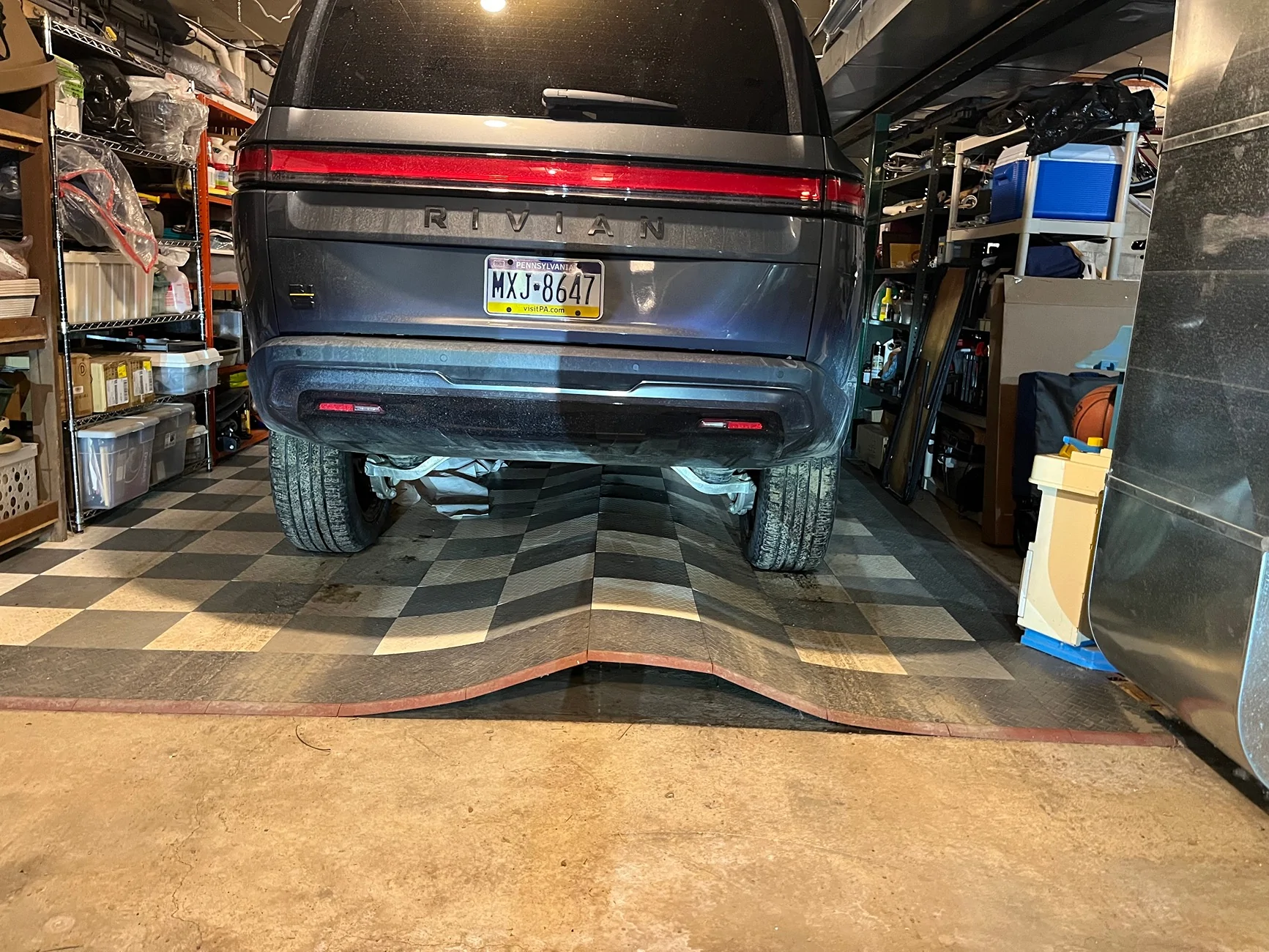 Rivian R1T R1S Anyone using garage tiles under their heavy Rivian? IMG_2342