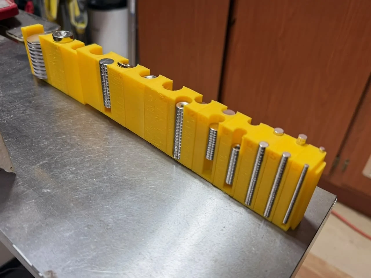 Rivian R1T R1S Gear tunnel mod to make the doors pop open (w/ magnets) IMG_0618
