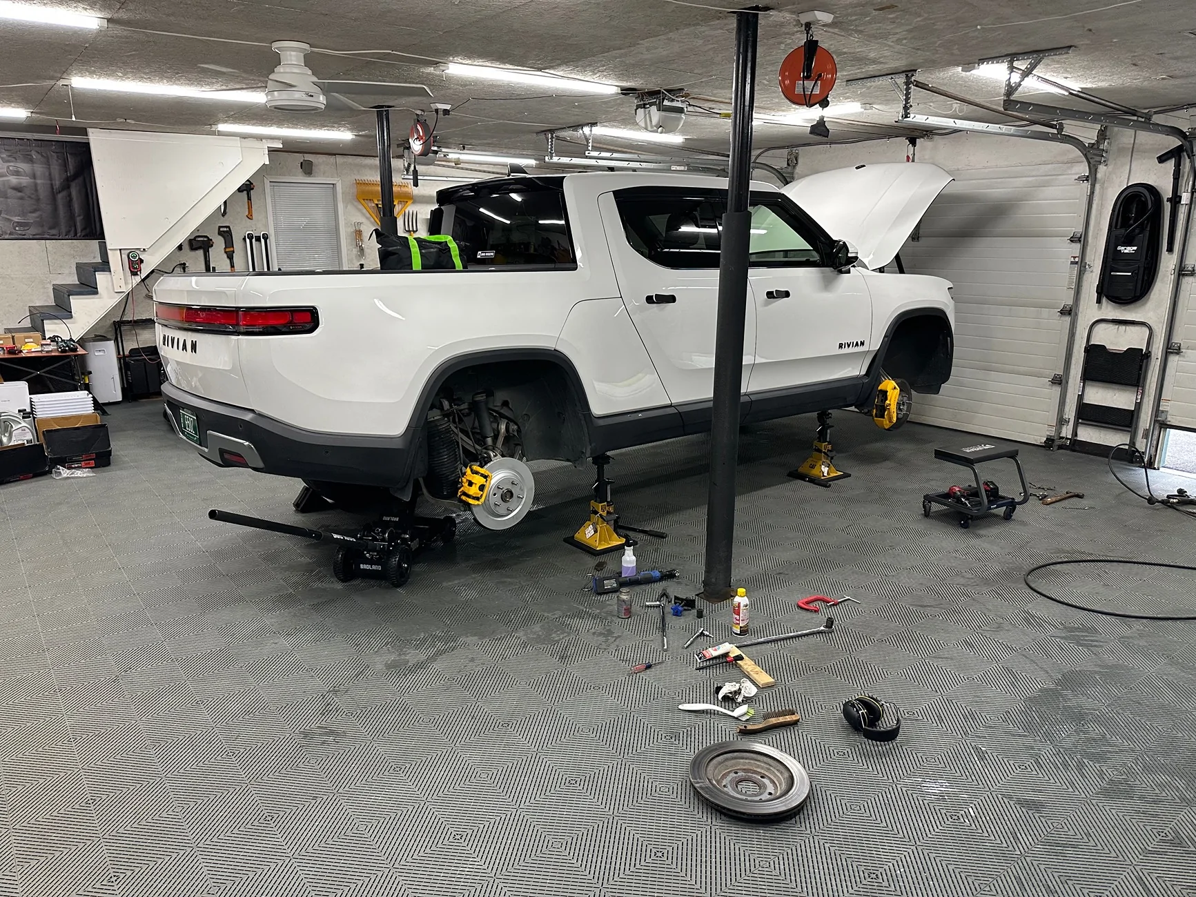 Rivian R1T R1S Anyone using garage tiles under their heavy Rivian? IMG_2252