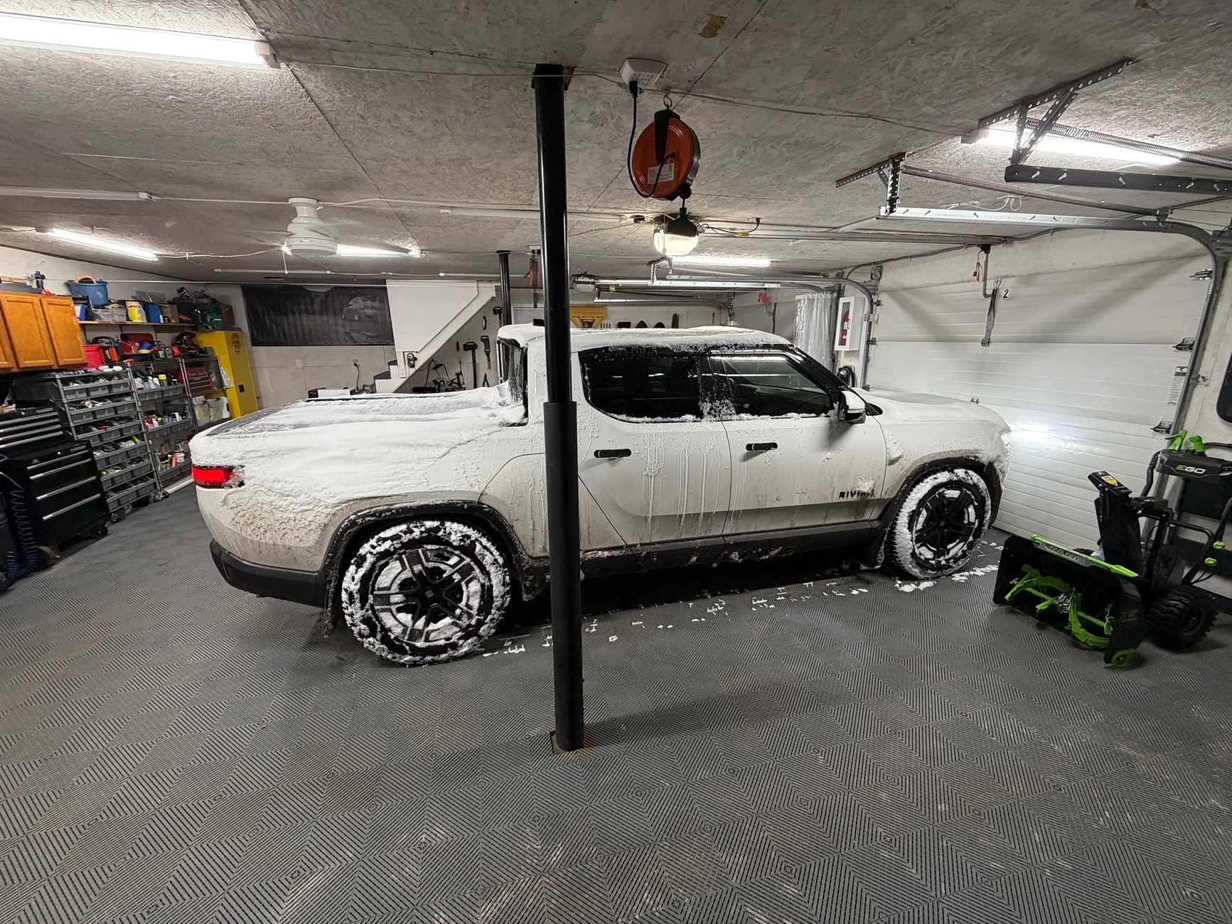 Rivian R1T R1S Anyone using garage tiles under their heavy Rivian? IMG_3728