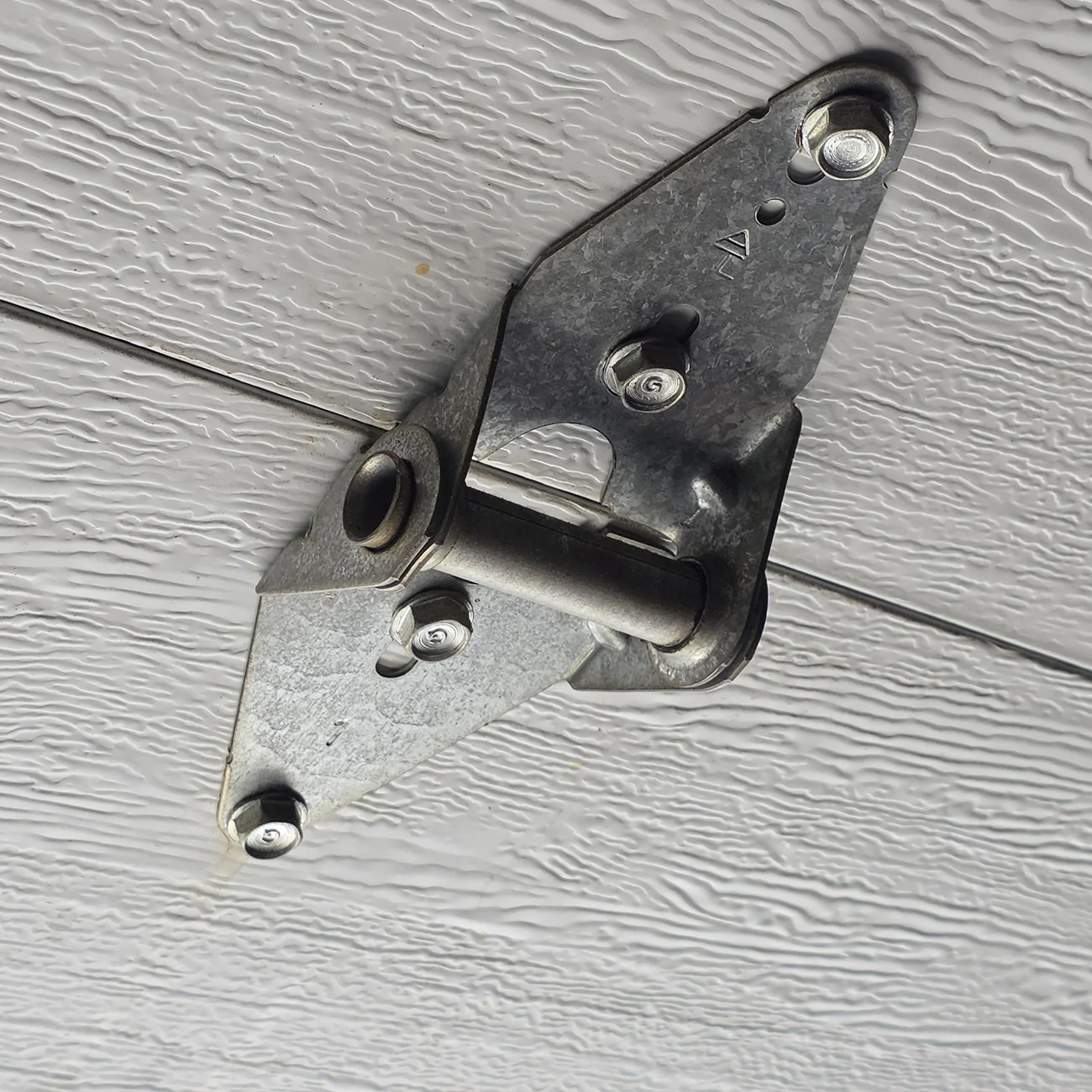 rivian tire stop garage hinge.webp