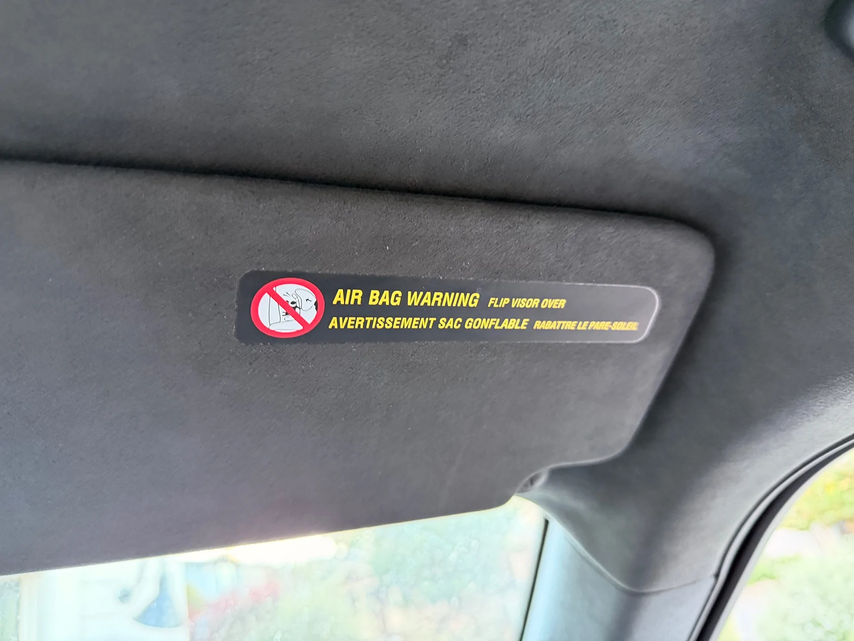 Rivian R1T R1S Covering up the visor warning labels IMG_0547