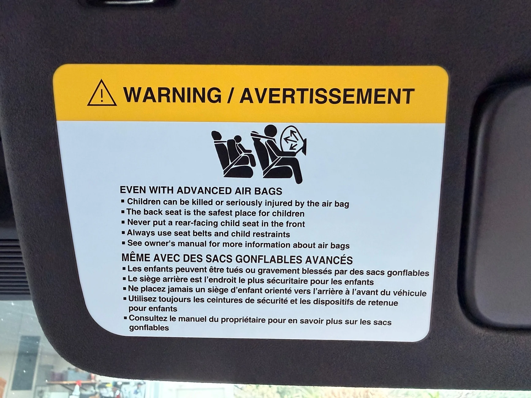 Rivian R1T R1S Covering up the visor warning labels IMG_0552