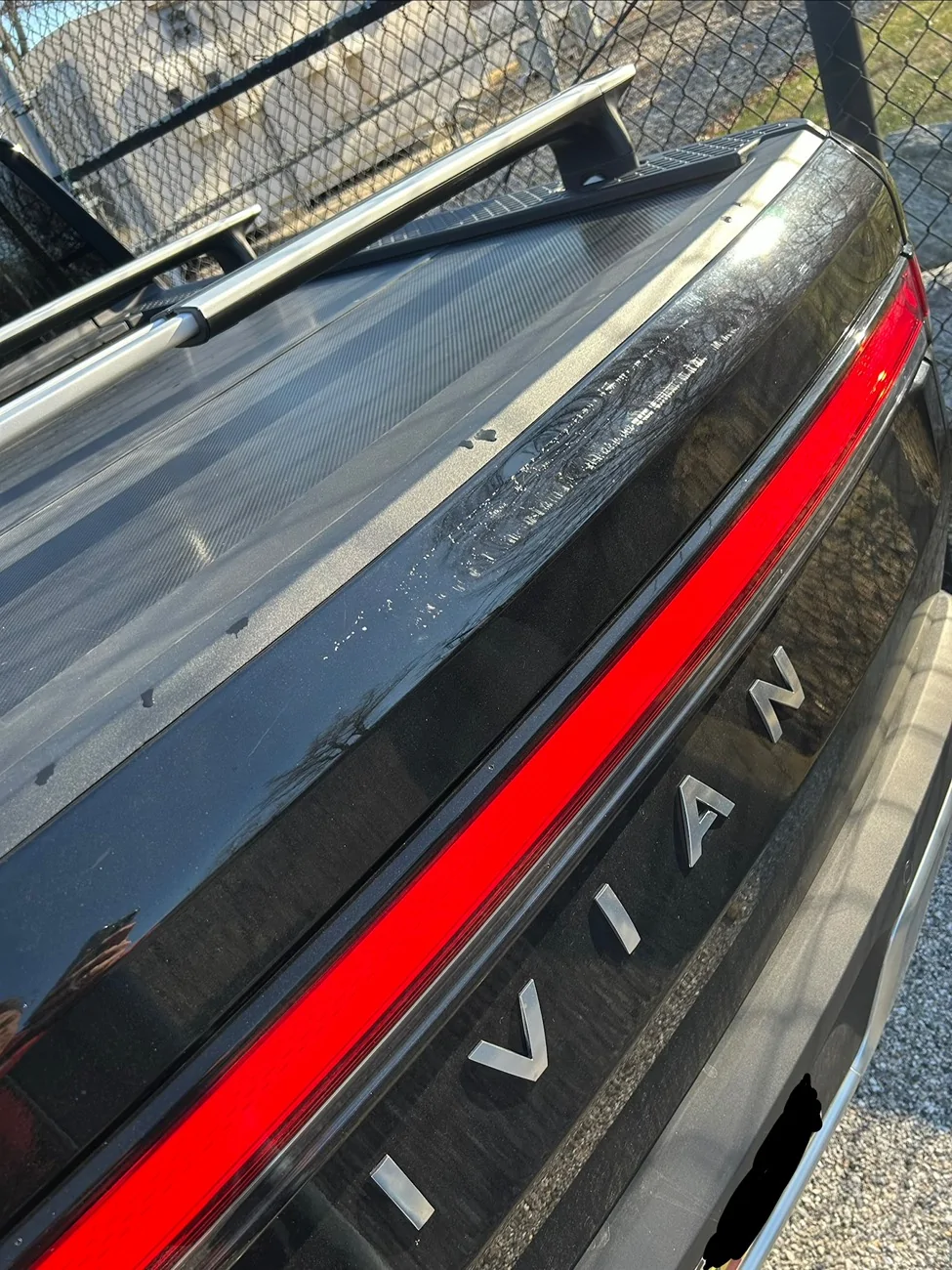 Rivian R1T R1S Dent and scratches in tailgate IMG_5269