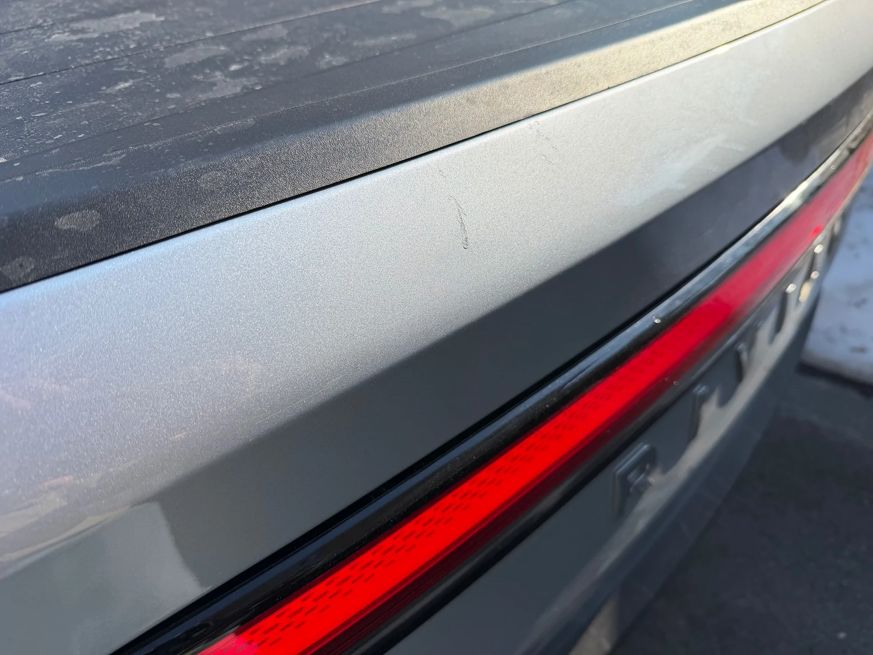 Rivian R1T R1S Dent and scratches in tailgate IMG_0333