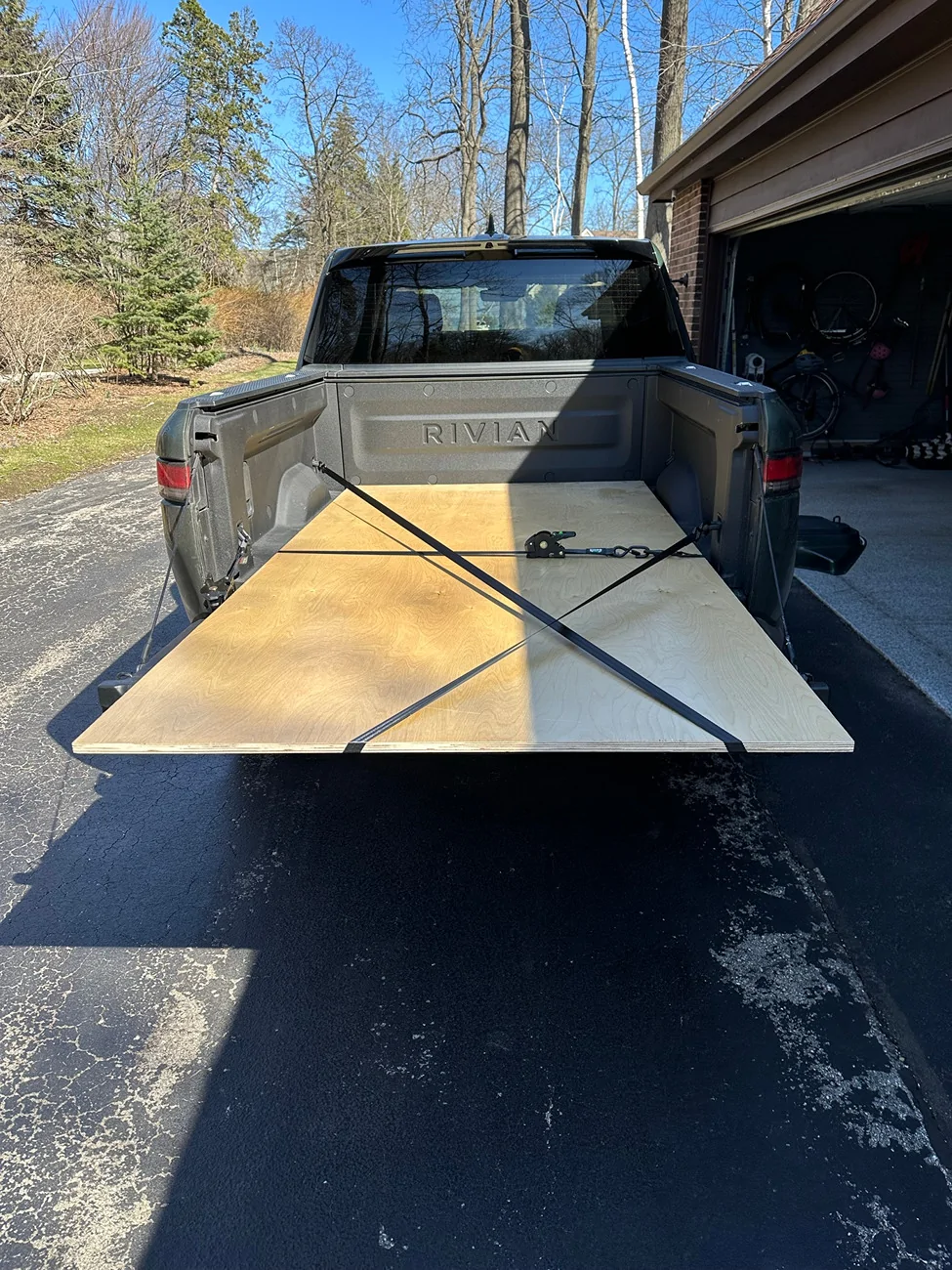 Rivian R1T R1S Securing plywood in R1T bed signal-2026-04-05-155449