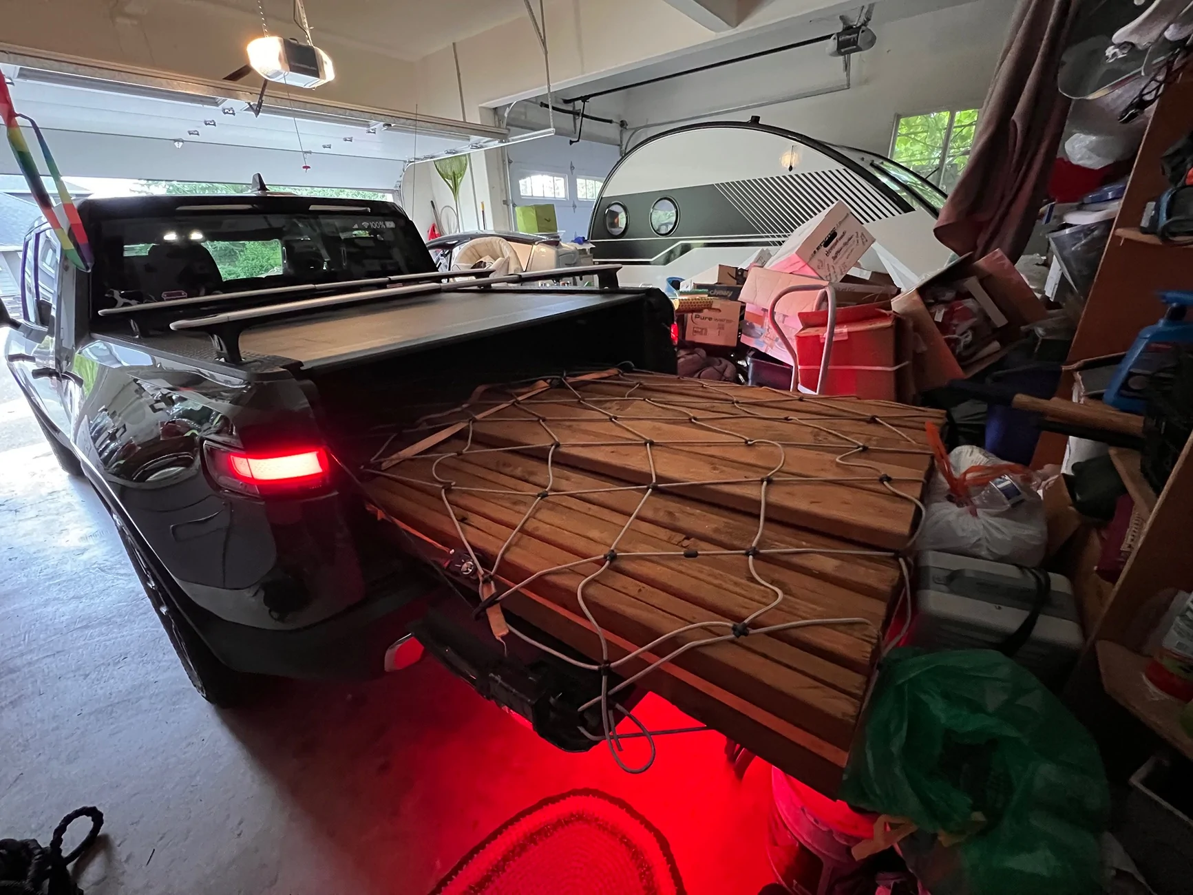 Rivian R1T R1S Securing plywood in R1T bed IMG_4950