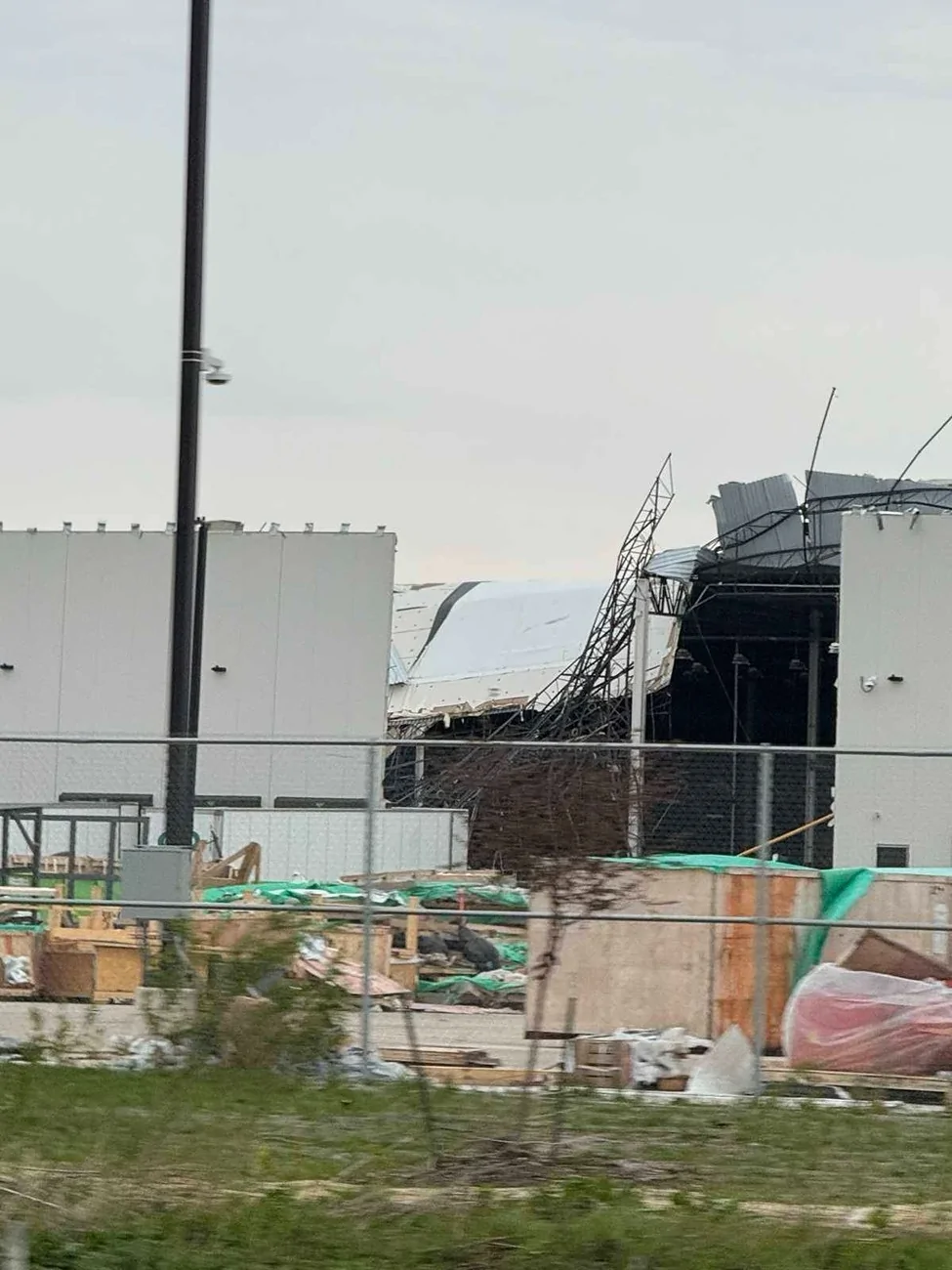 Rivian R1T R1S R2 Factory (Building 2 - Body Shop and General Assembly) damaged by tornado storm (April 17) HGMgOExWYAAeWFU