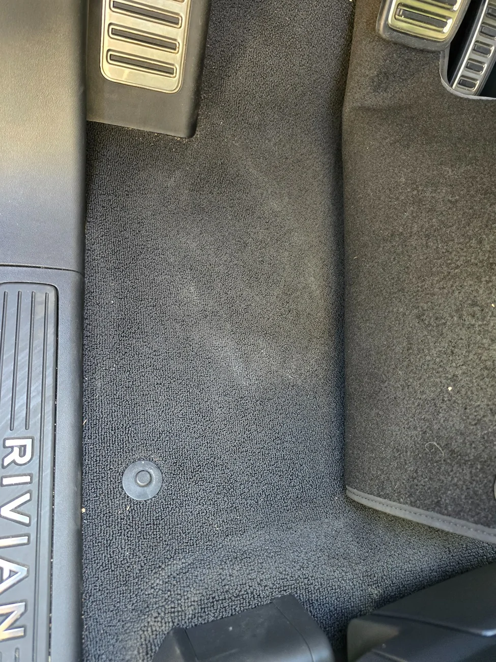 Rivian R1T R1S Wet spot under driver mat 20260418_155130