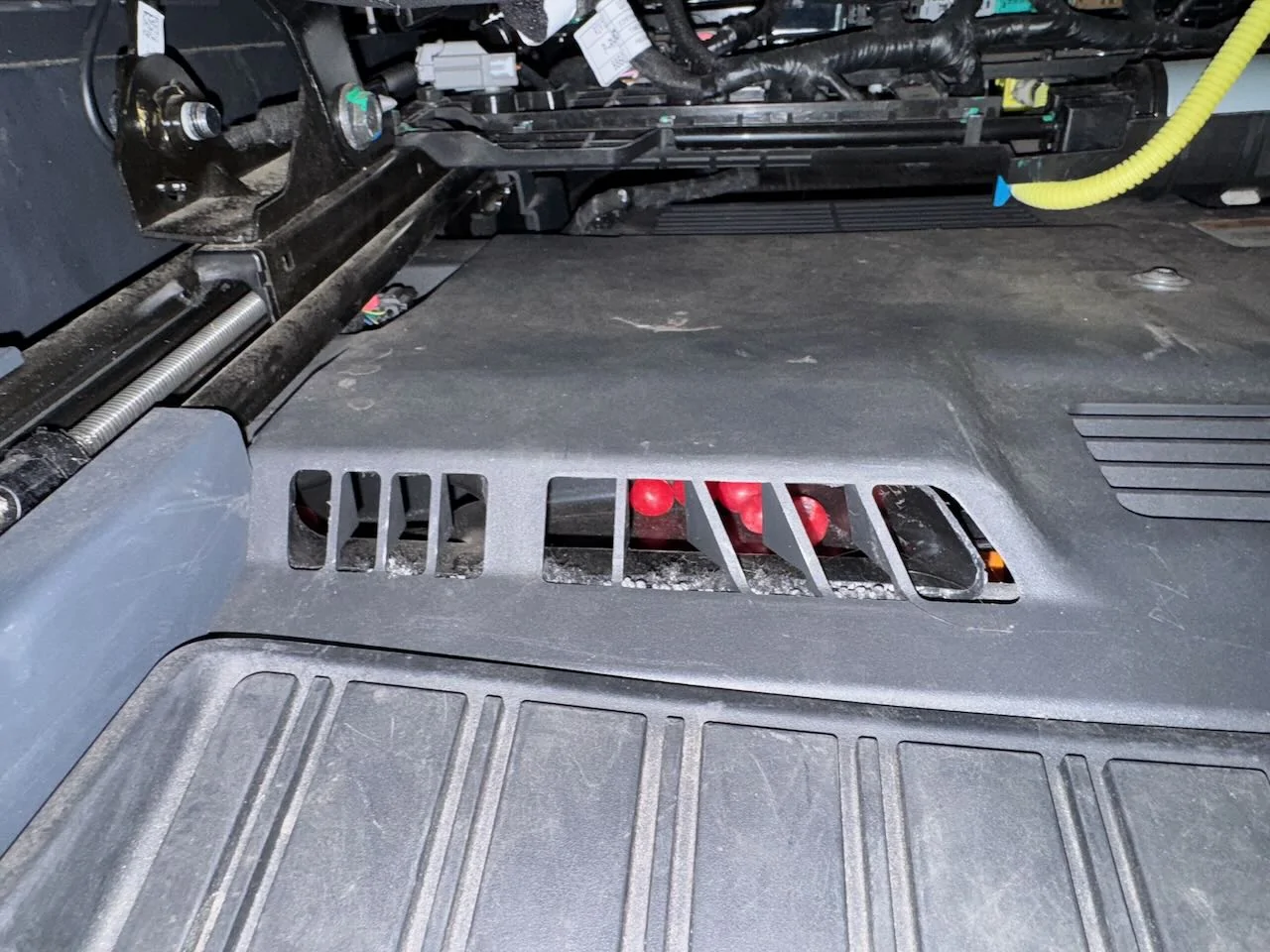 Rivian R1T R1S How to open up the rear seat floor vents? IMG_2621