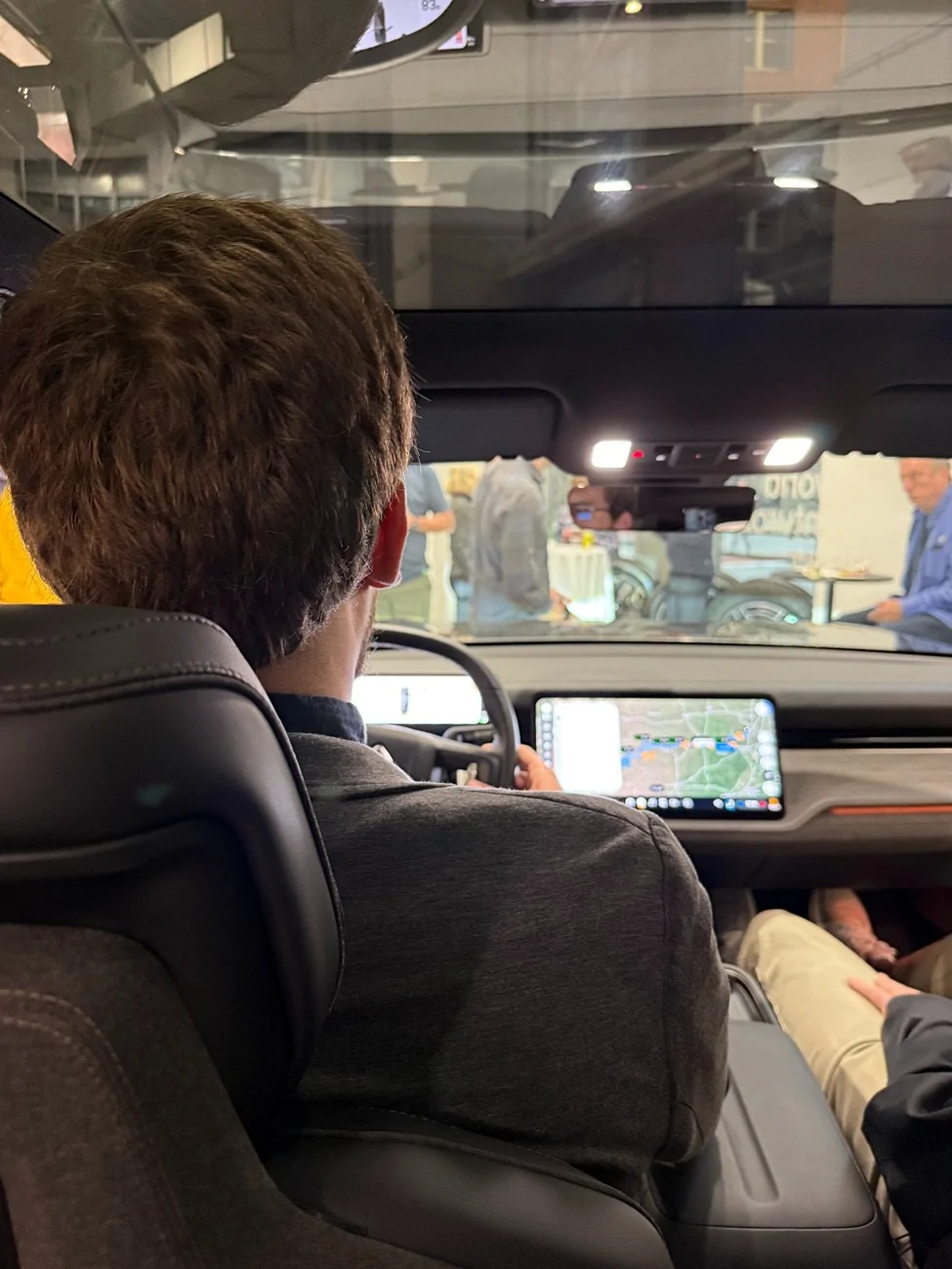 Rivian R1T R1S Tall & big people fit in R2 with impressive legroom & headroom (even 7 foot driver / passenger!) tall driver leg room rivian r2 interior 2