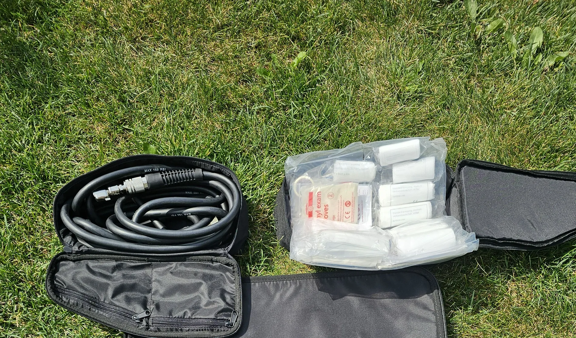 Rivian R1T R1S First Aid Kit and OEM Air Compressor Hose Rivian Pouch Openedcomp first