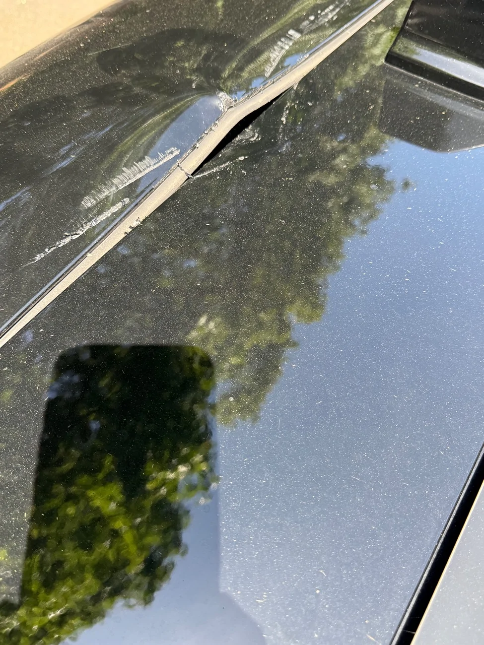 Rivian R1T R1S R1S lift gate hit the roof damaging the lift gate and the roof IMG_1969