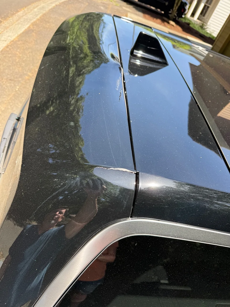 Rivian R1T R1S R1S lift gate hit the roof damaging the lift gate and the roof IMG_1964