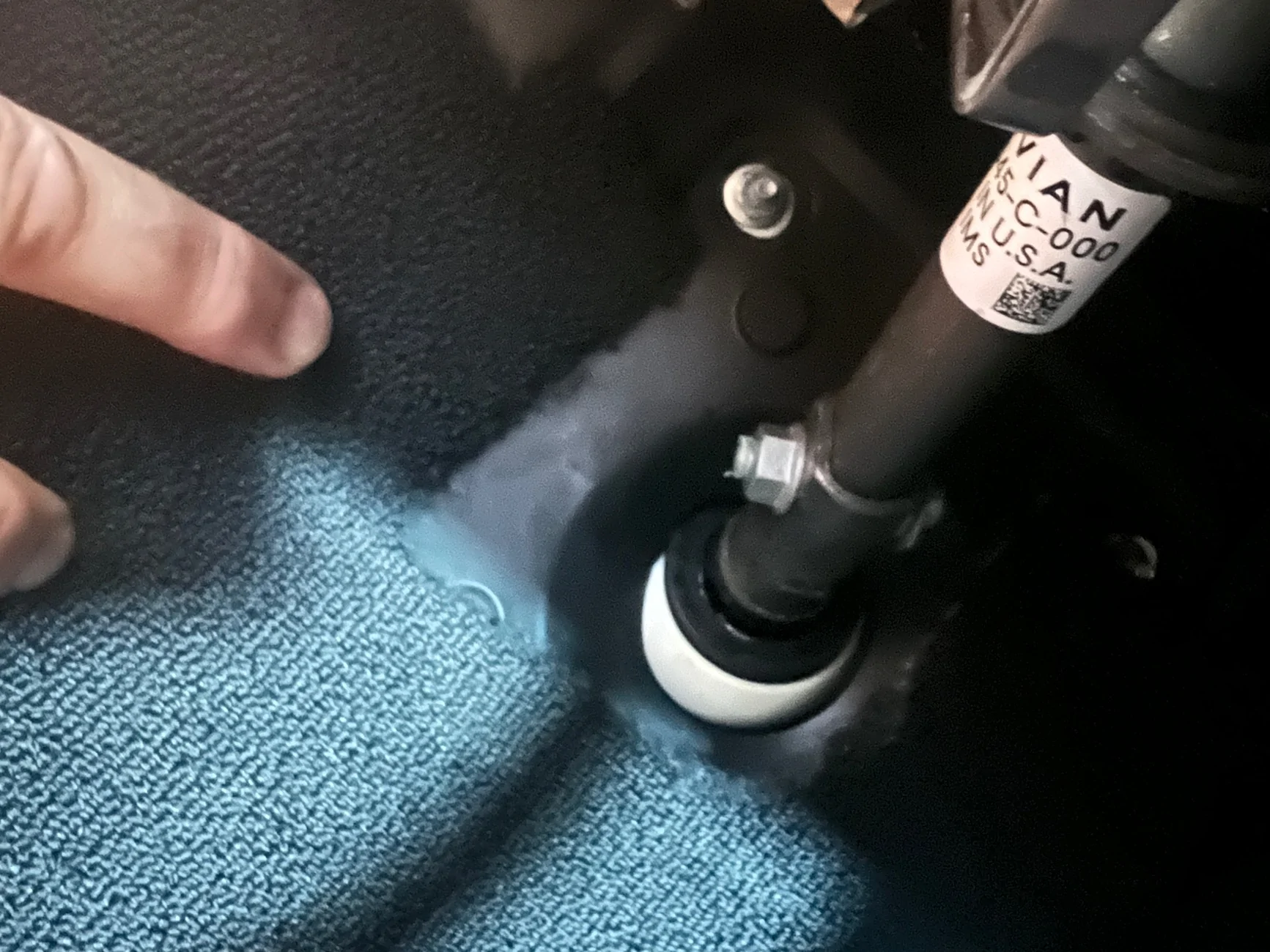 Rivian R1T R1S Wet spot under driver mat IMG_4528