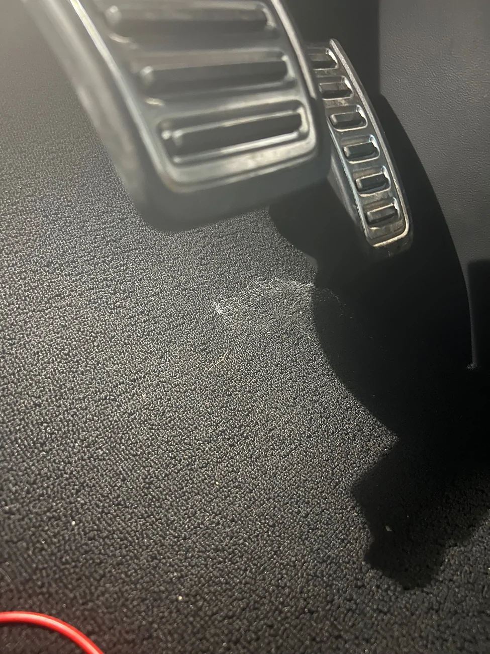 Rivian R1T R1S Wet spot under driver mat IMG_4499