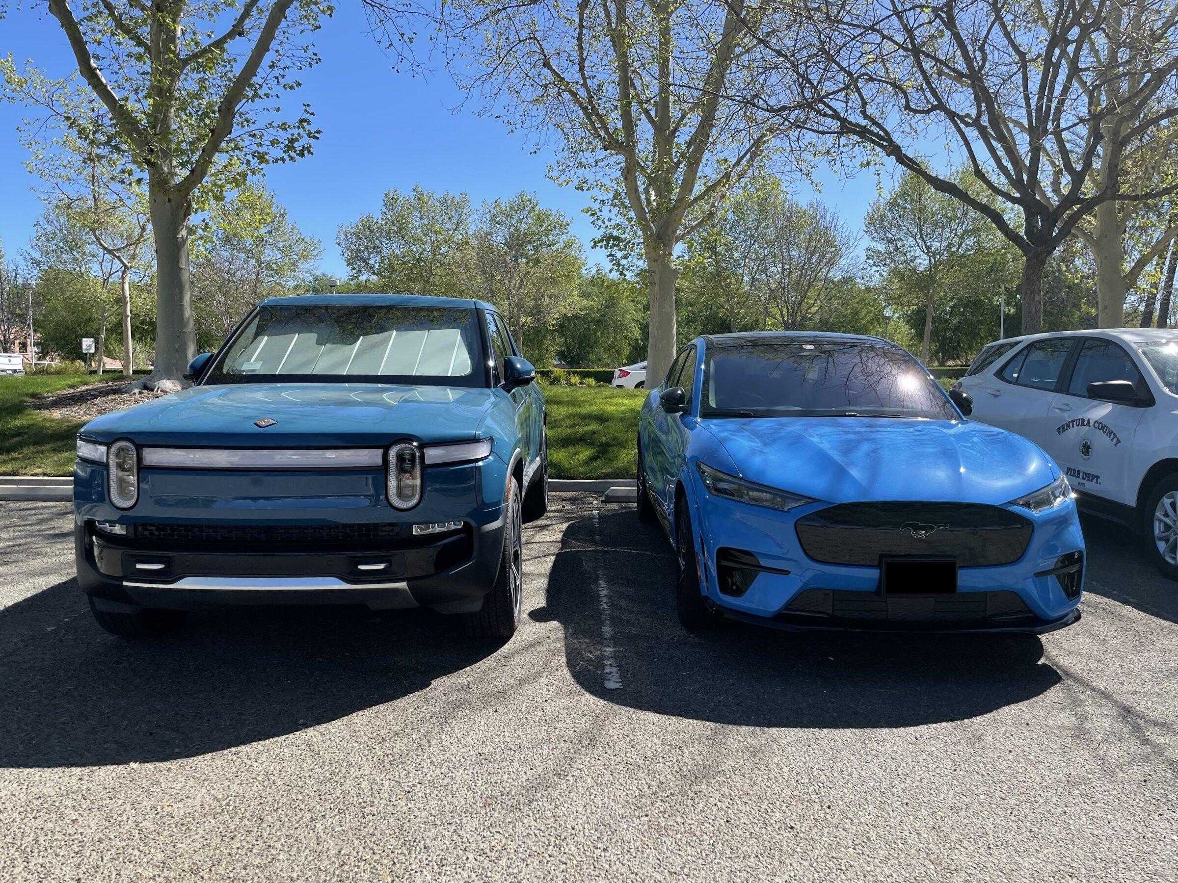Rivian R1T R1S Rivian Blue R1T vs Grabber Blue Mach-E GT a side by side comparison look image_50428673-