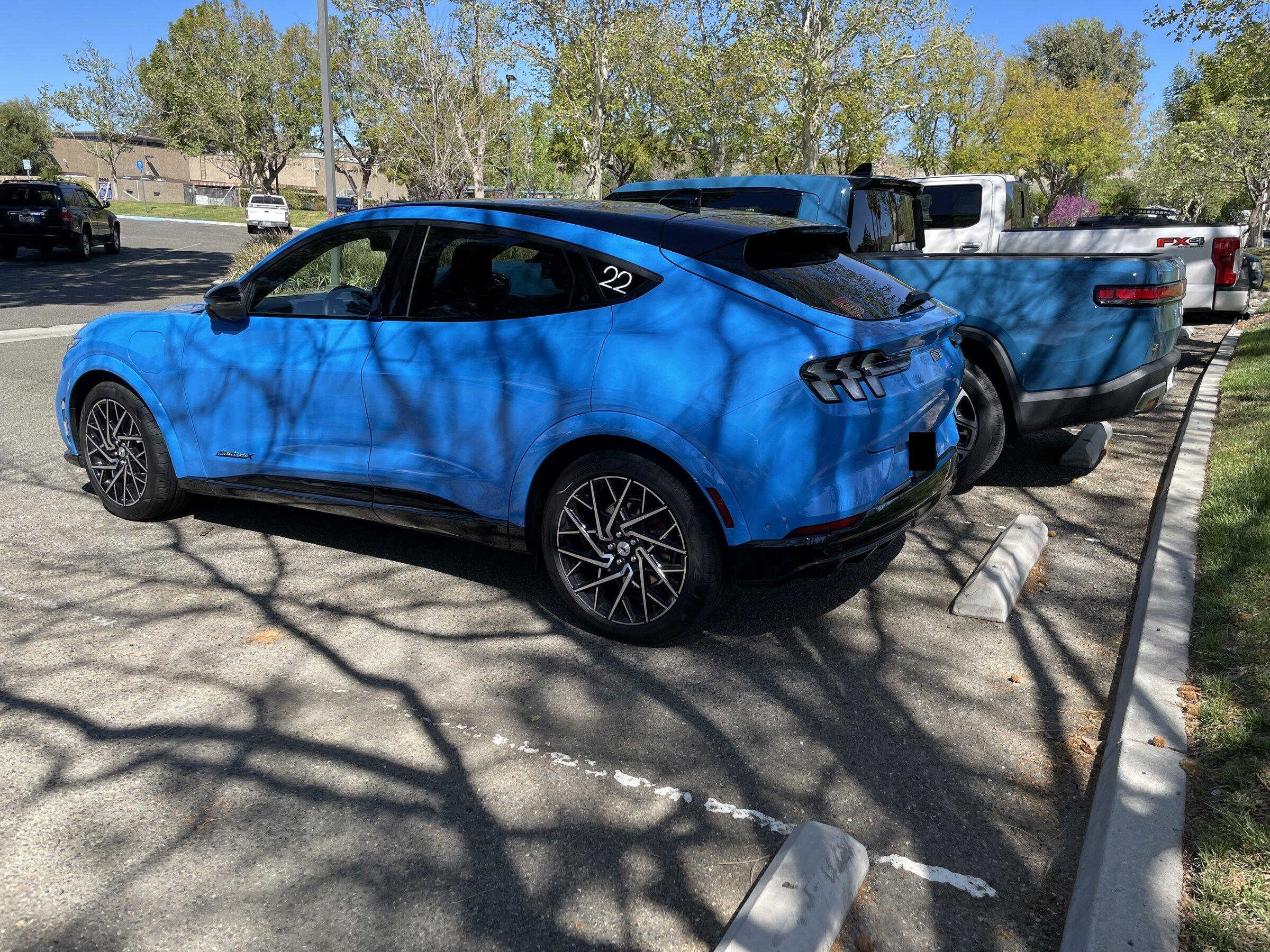 Rivian R1T R1S Rivian Blue R1T vs Grabber Blue Mach-E GT a side by side comparison look image_16901121-