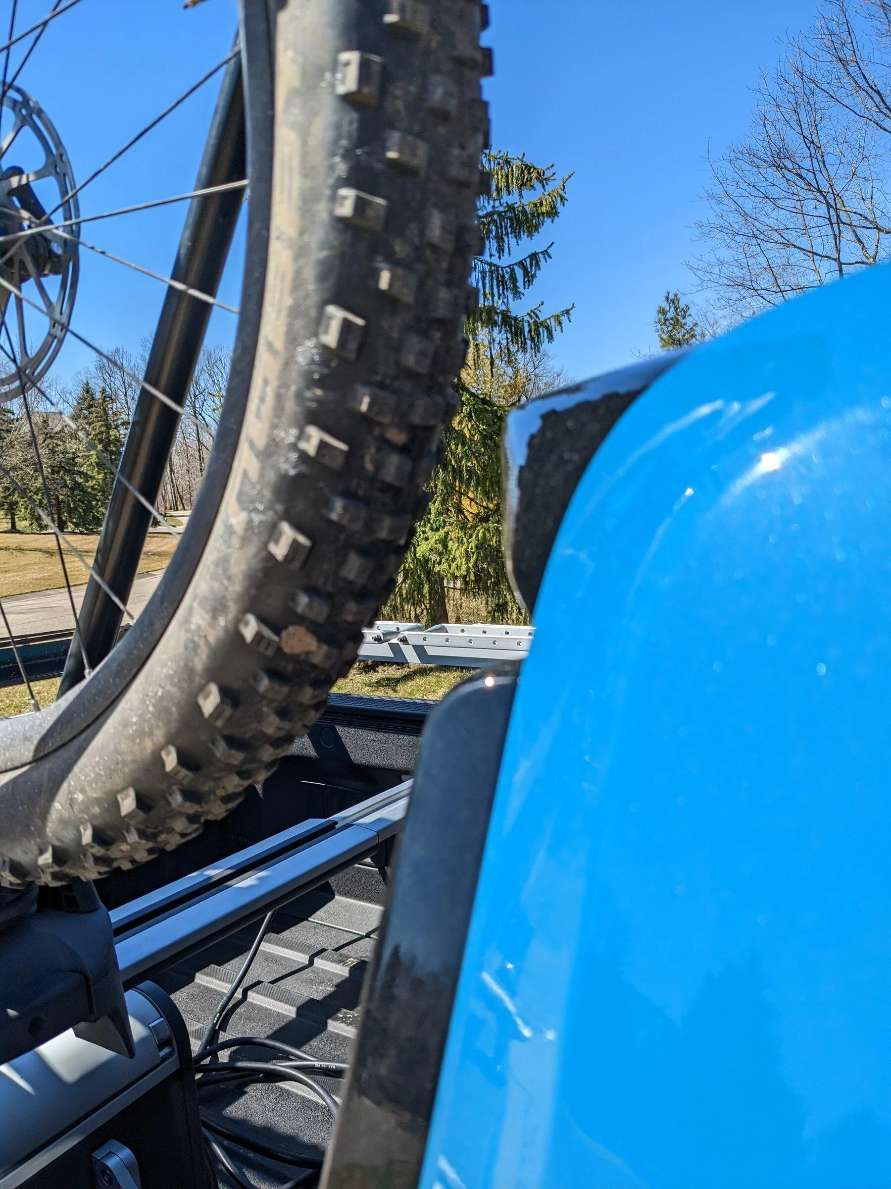 Rivian R1T R1S Yakima Front Loader installed on cargo rails over the bed PXL_20220410_162128268