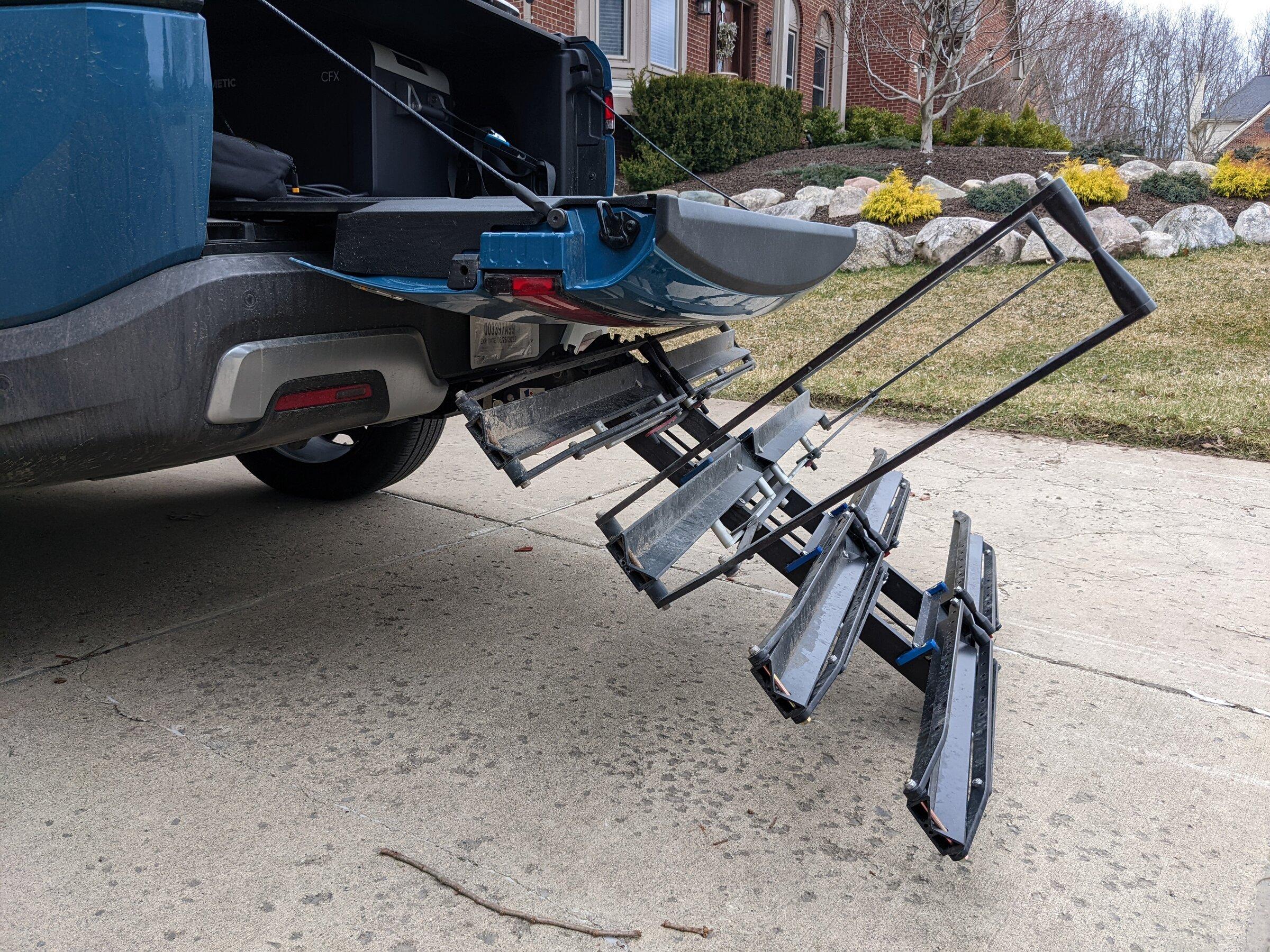 Rivian R1T R1S Yakima Front Loader installed on cargo rails over the bed PXL_20220411_224219438