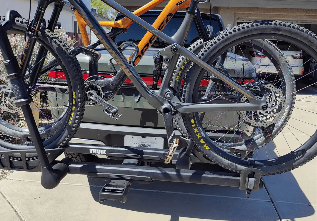 Rivian R1T R1S Thule ProRide XT and 29er mounted hitch mount thule rise spur