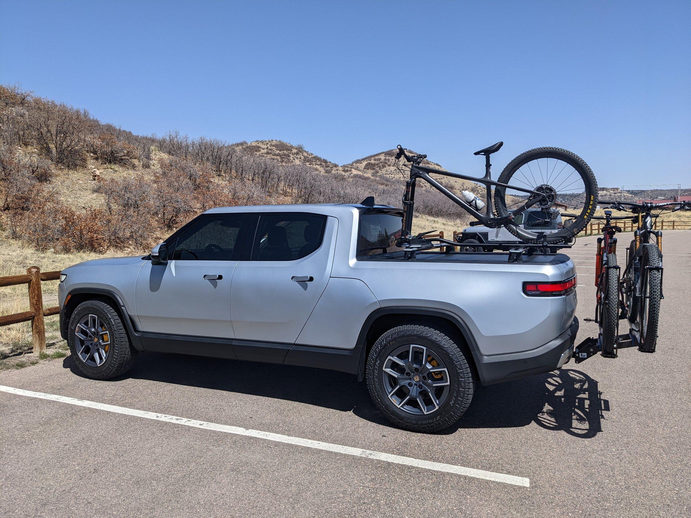 Rivian R1T R1S R1T over-bed bikes on Yakima HighRoad Bike Mount PXL_20220418_192454431