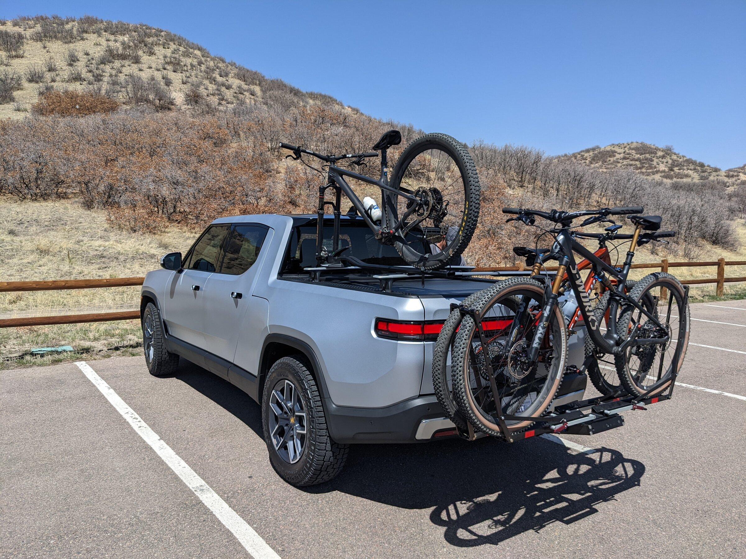 Rivian R1T R1S R1T over-bed bikes on Yakima HighRoad Bike Mount PXL_20220418_192430560