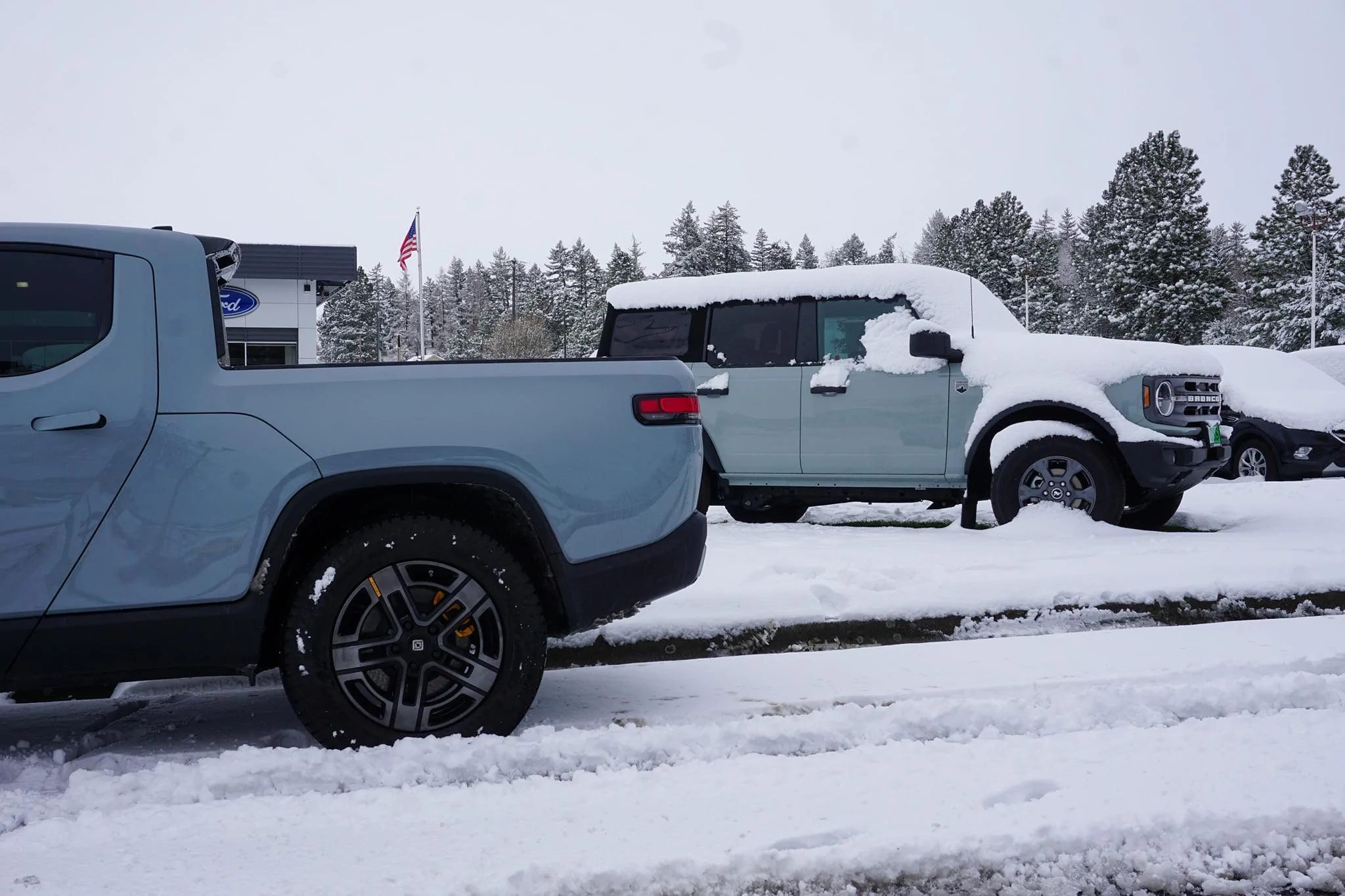 Rivian R1T R1S LIMESTONE R1T Photos Limestone Rivian R1T vs Cactus Gray Bronco 4