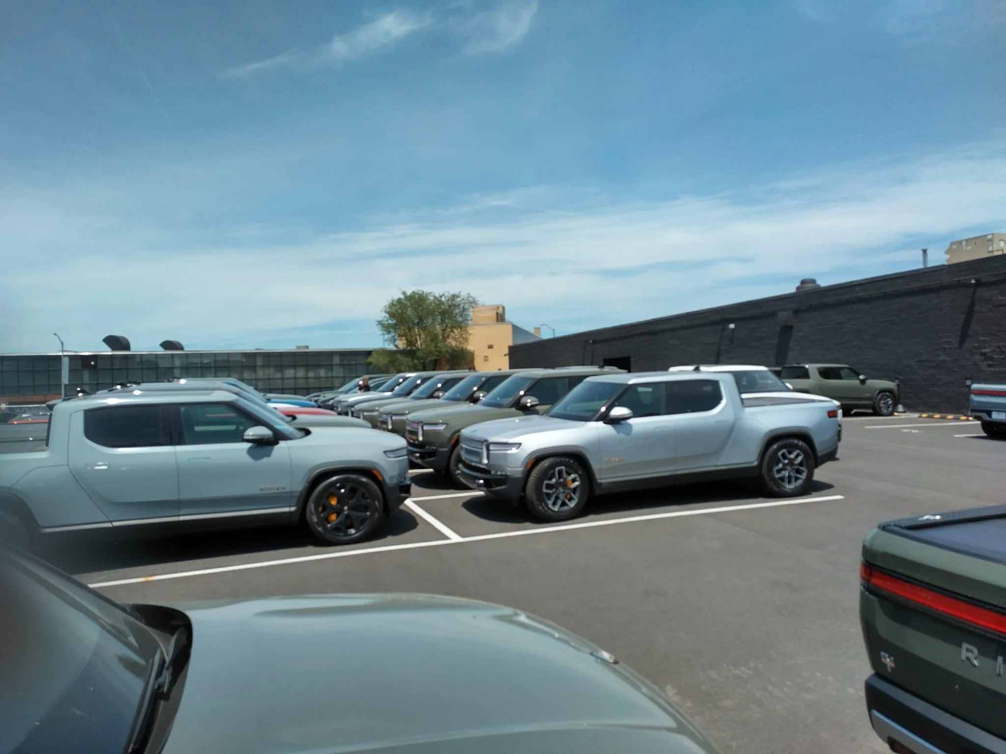 Rivian R1T R1S Current look at Brooklyn Rivian Service Center's parking lot full of R1T Brooklyn Rivian Service Center's parking lot full of R1T3