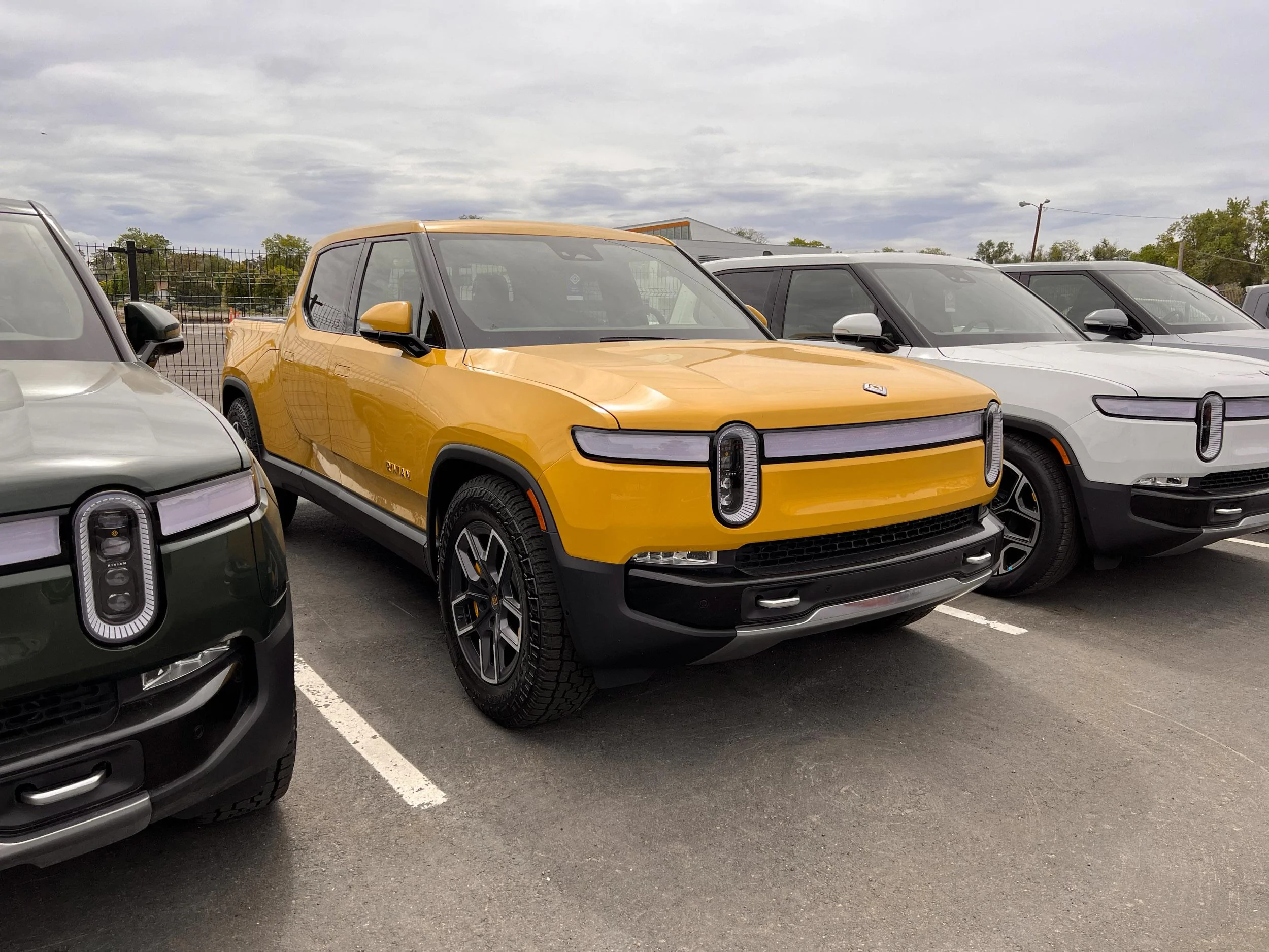 Rivian R1T R1S Compass Yellow Rivian R1T at the Denver Service Center! 67467034166__7E0296D1-B102-41A8-BBE5-C0DB368FC17A
