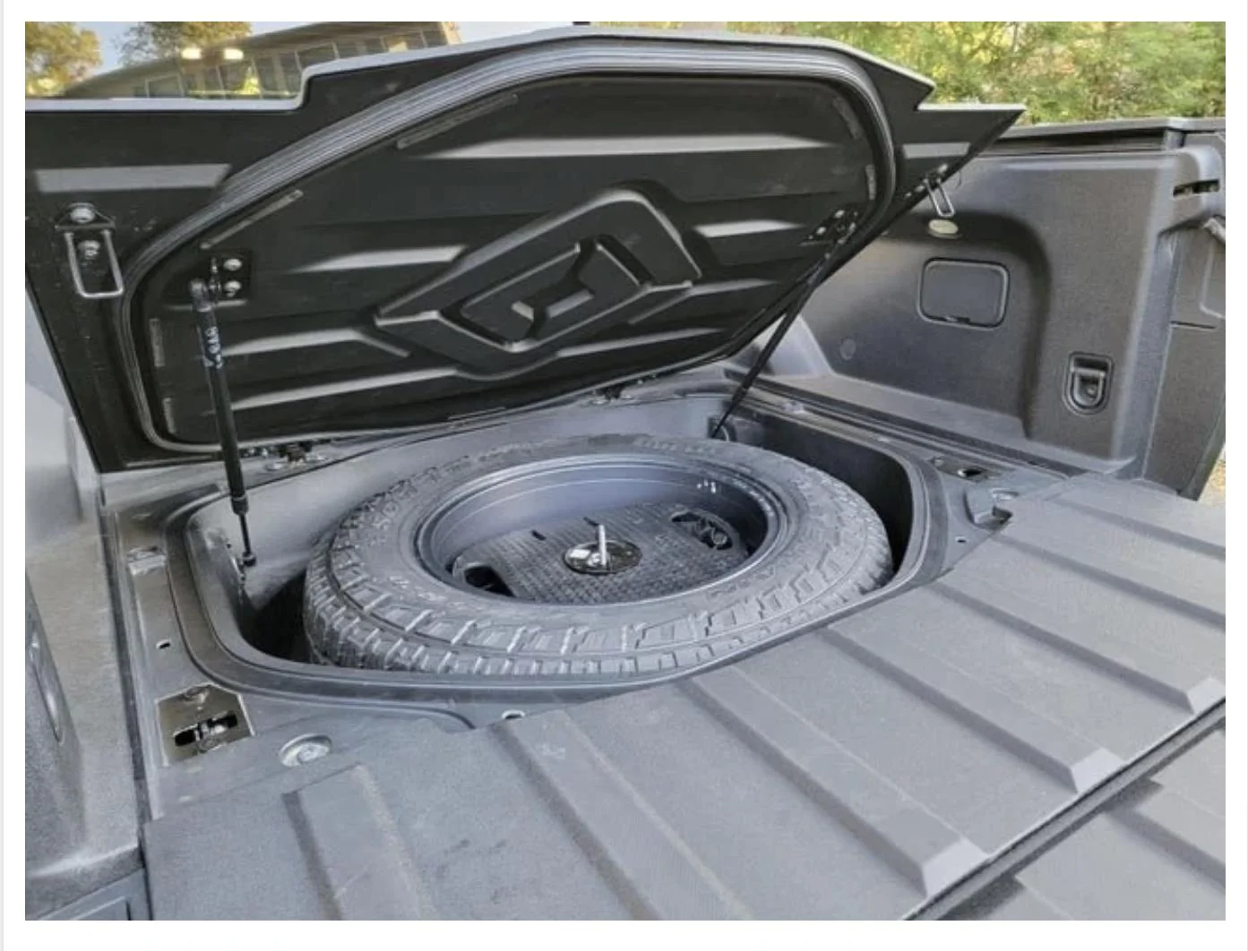 Rivian R1T R1S How do you access the spare if you are using the cross bars? 8BB615AE-53F9-4982-B273-15487857B4BA