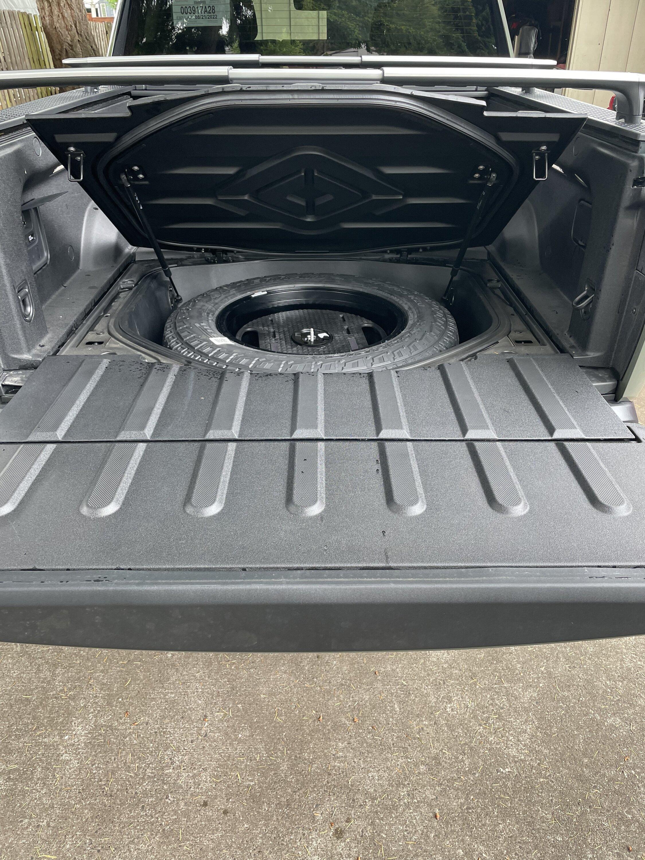 Rivian R1T R1S How do you access the spare if you are using the cross bars? 6538A017-D24B-4F3C-87FE-DB8DB70A16BA