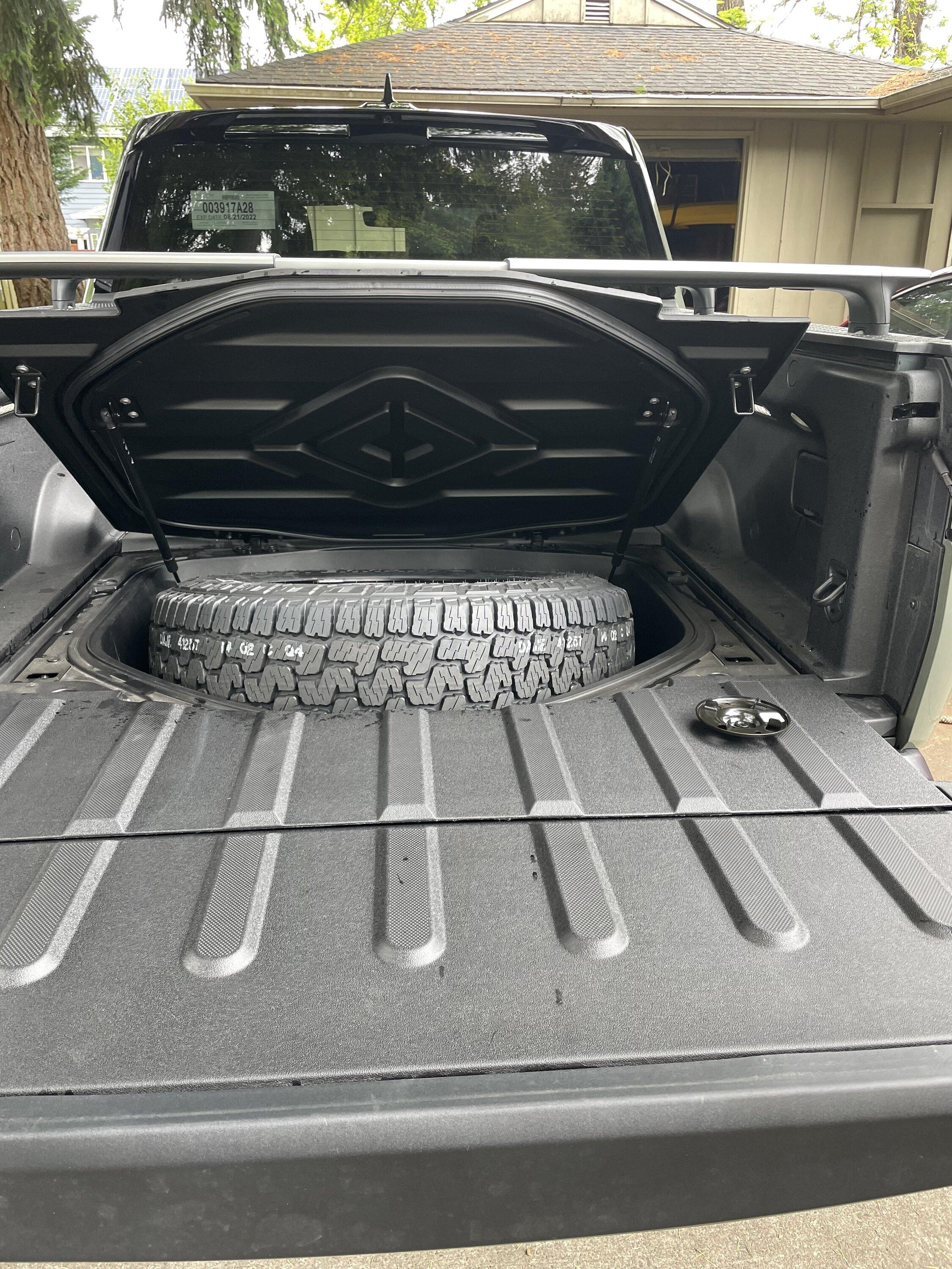 Rivian R1T R1S How do you access the spare if you are using the cross bars? 9FFF642A-5580-4D79-9802-6F323CD22093