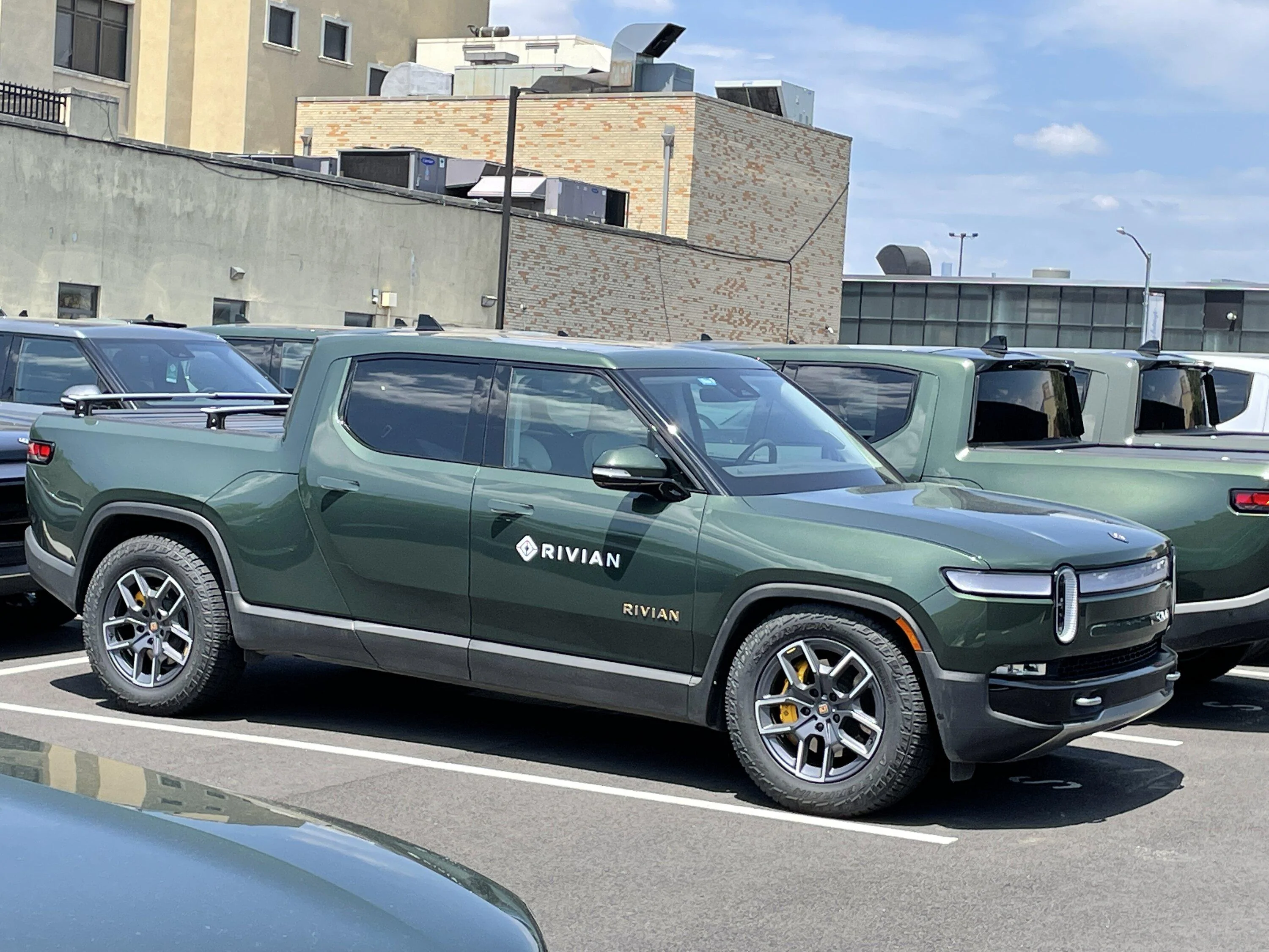Rivian R1T R1S Current look at Brooklyn Rivian Service Center's parking lot full of R1T A86163E3-5EE2-4AF2-93DC-8BA77E781D8B