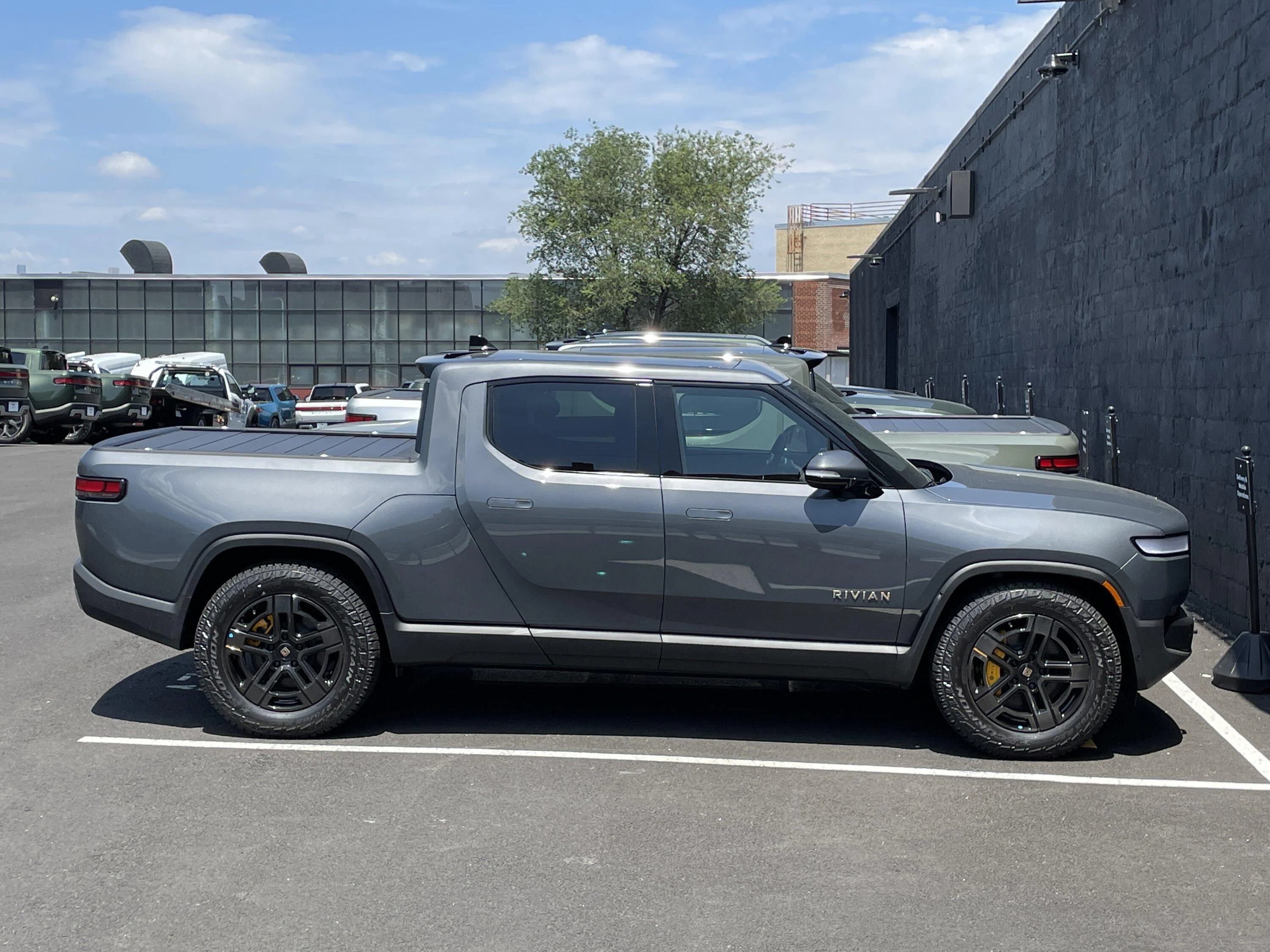 Rivian R1T R1S Current look at Brooklyn Rivian Service Center's parking lot full of R1T 985DBAC3-B278-4075-8770-D71B83785548