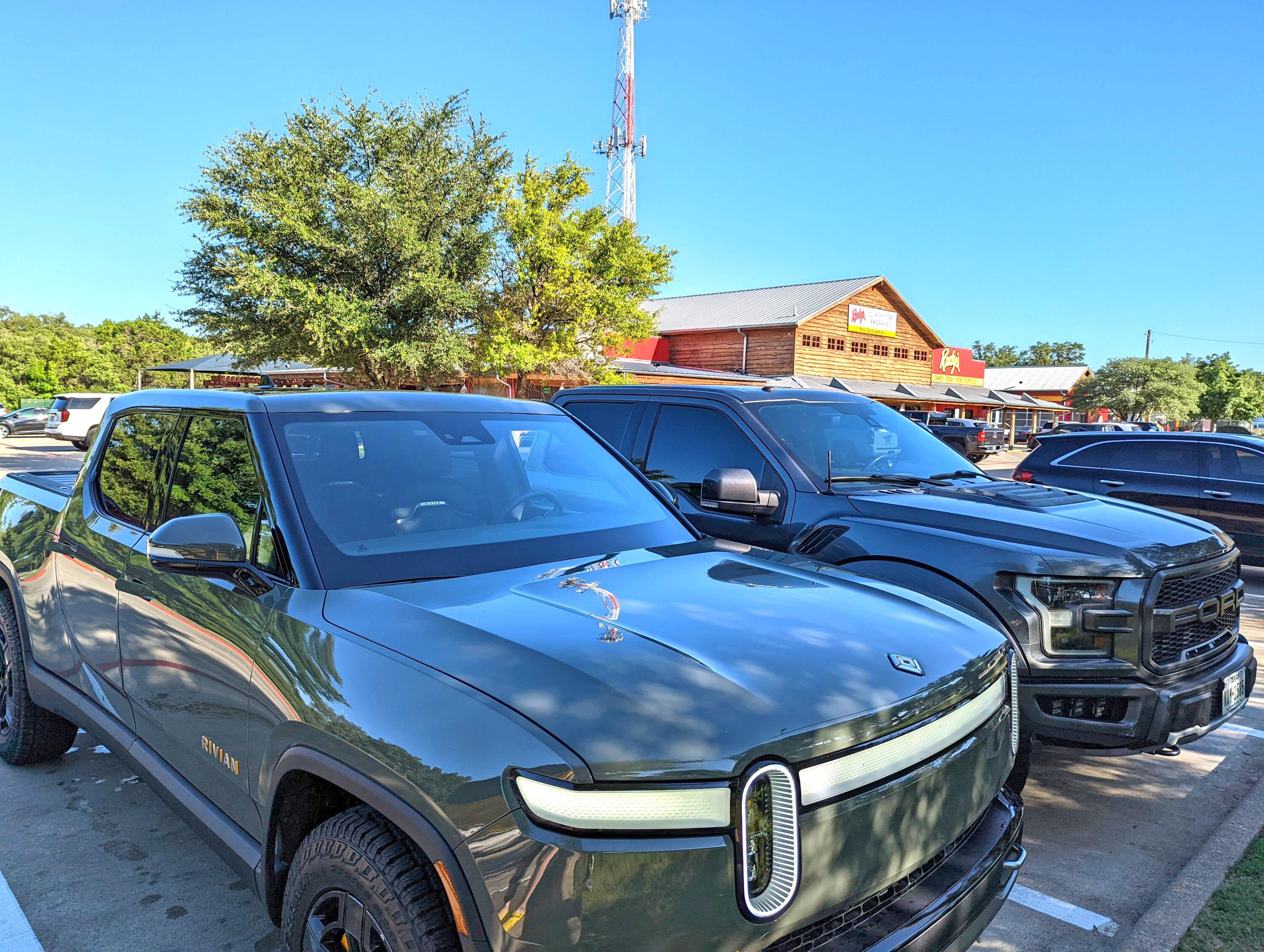 Rivian R1T R1S Rivian R1T vs. Ford Raptor comparison side by side PXL_20220604_230155553