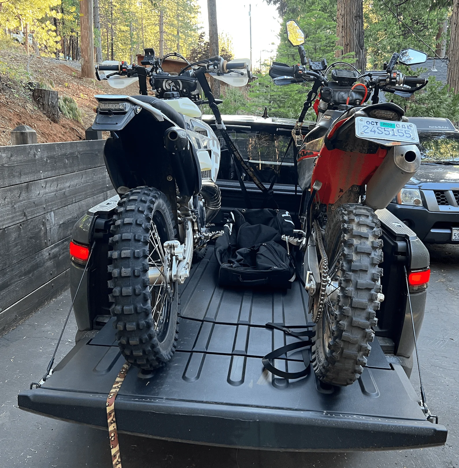 Rivian R1T R1S Rivian hauling dirt bikes in bed -- test fitting TE300 and 500 KTM 1656448563360