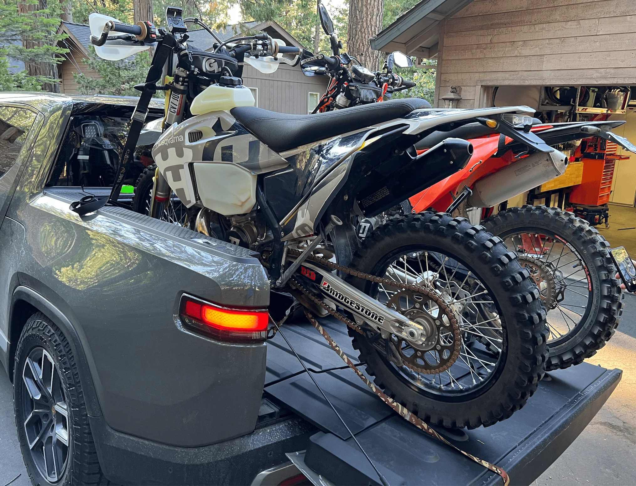 Rivian R1T R1S Rivian hauling dirt bikes in bed -- test fitting TE300 and 500 KTM 1656448592905