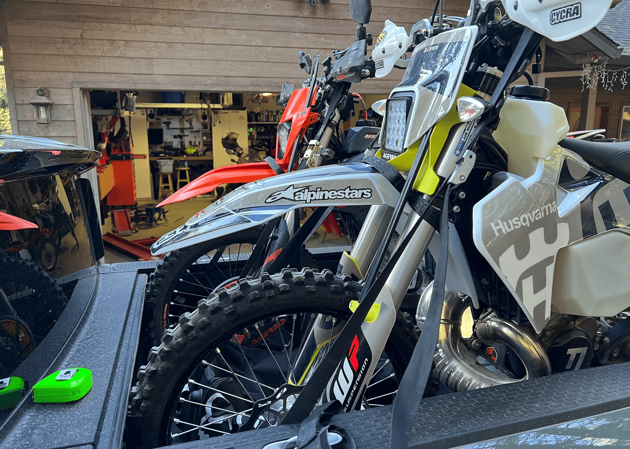 Rivian R1T R1S Rivian hauling dirt bikes in bed -- test fitting TE300 and 500 KTM 1656448628847
