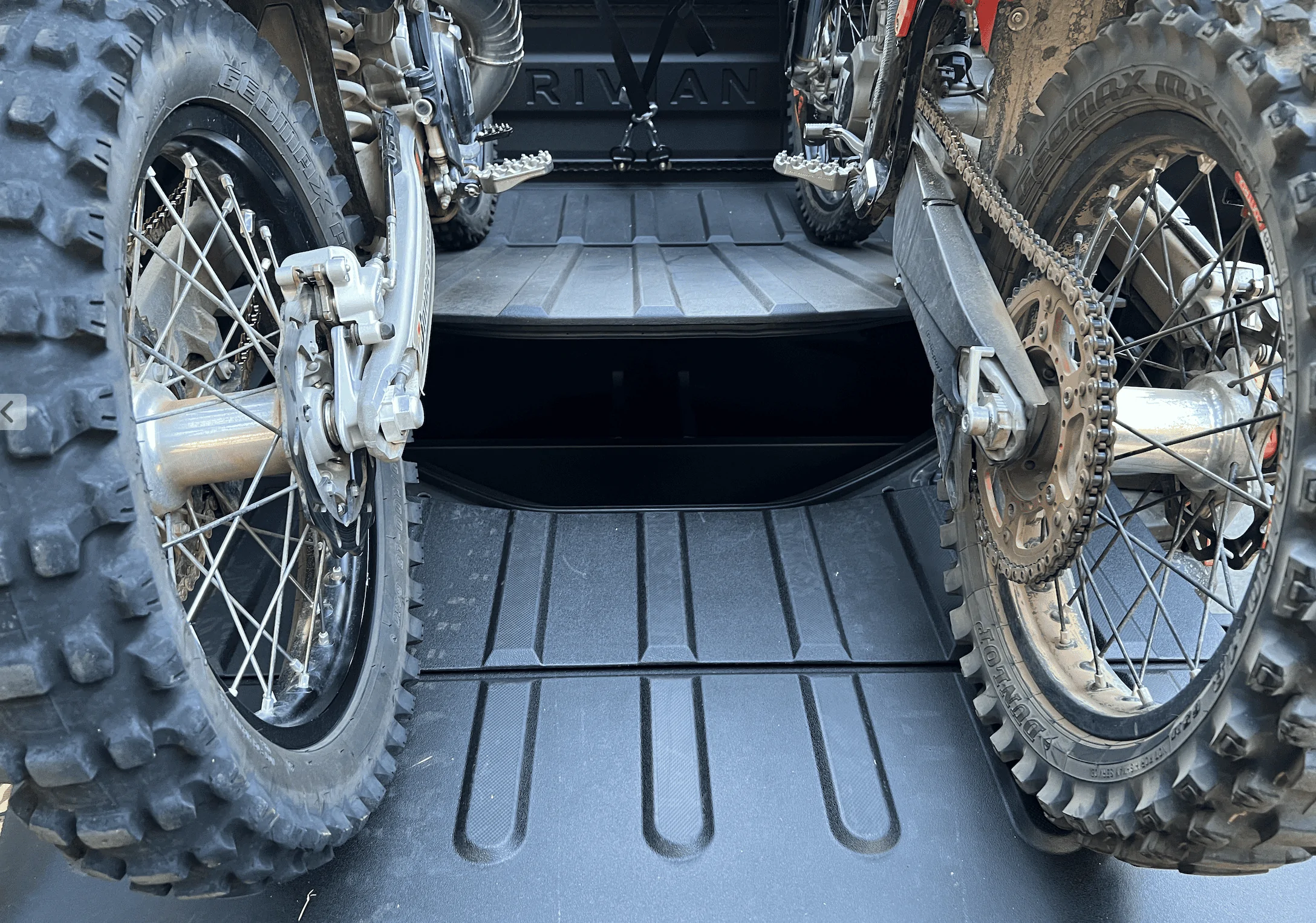 Rivian R1T R1S Rivian hauling dirt bikes in bed -- test fitting TE300 and 500 KTM 1656448666790
