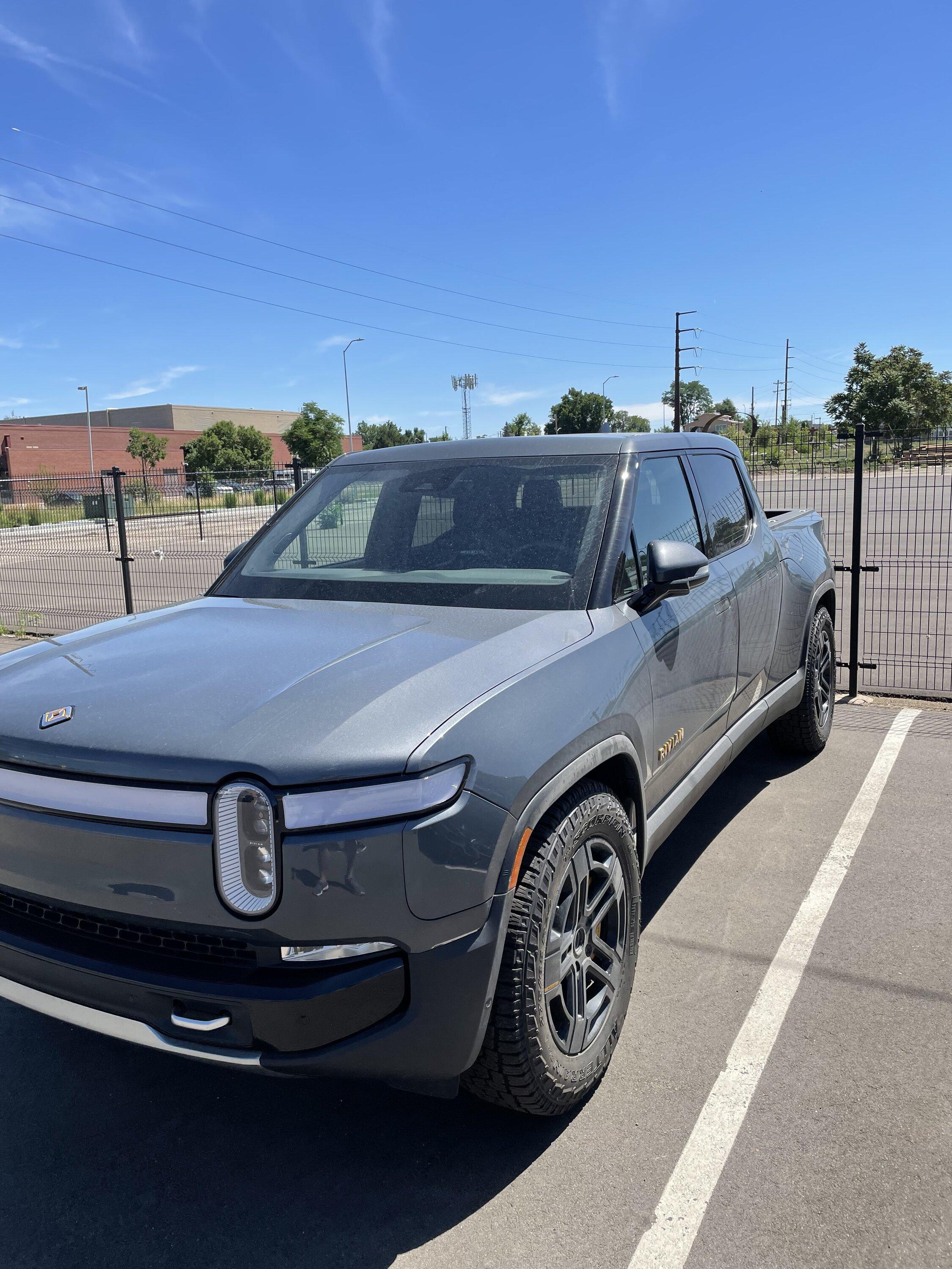 Rivian R1T R1S Limestone next to Subaru's light blue D0D66DC3-6F6A-472D-80F4-9D98772FB1E1
