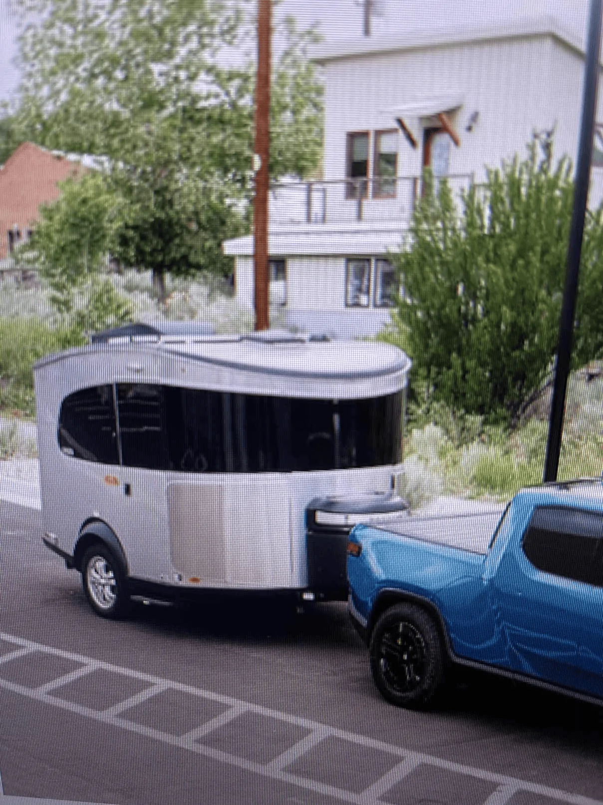 Rivian R1T R1S Does anyone know what camping trailer this Rivian R1T is pulling? [Updated: Airstream Basecamp] 1657828667854