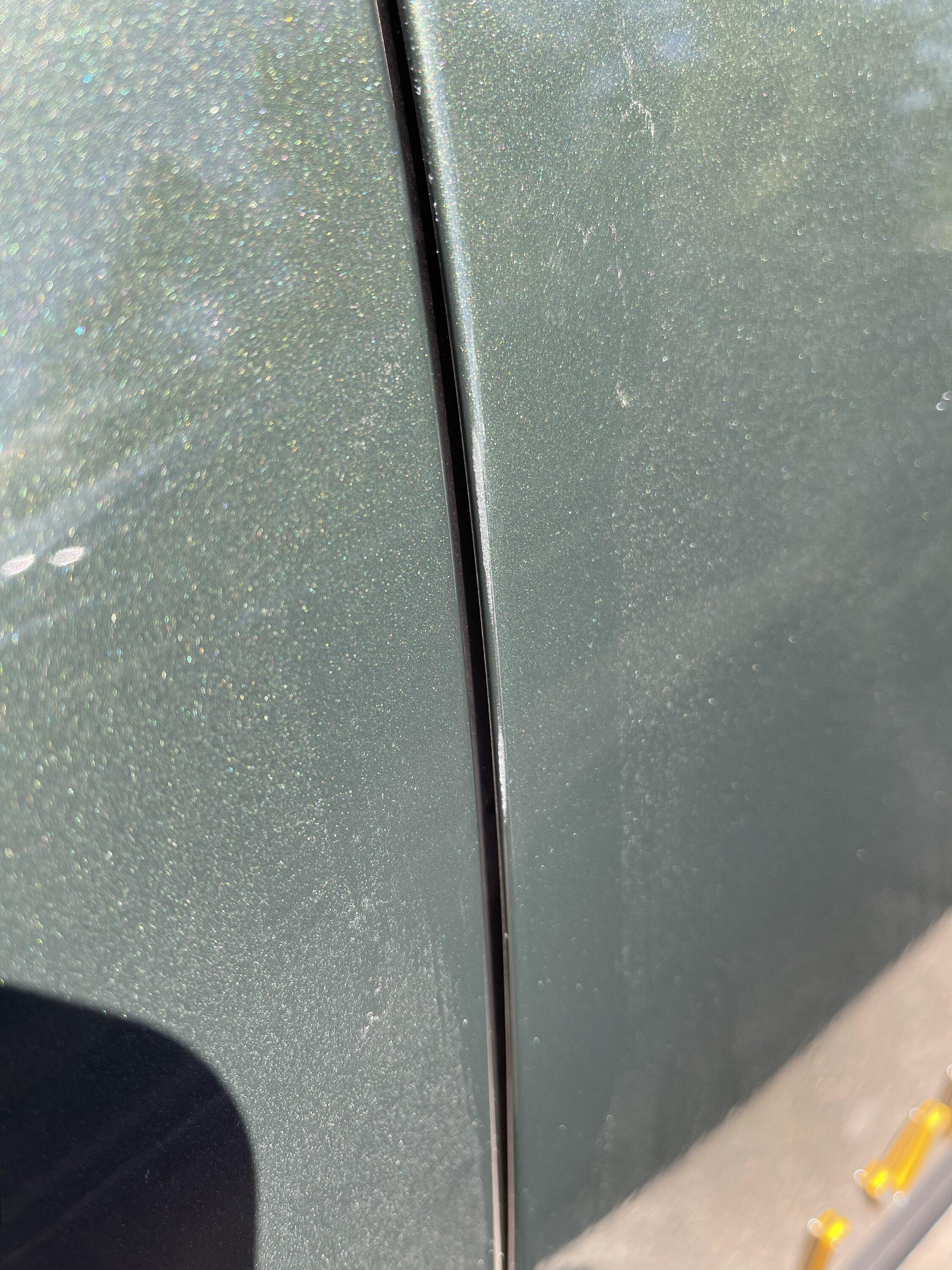 Rivian R1T R1S Driver side door rubbing, causing paint issues. 01057C08-465E-4BFD-9ED0-10DCFA087849