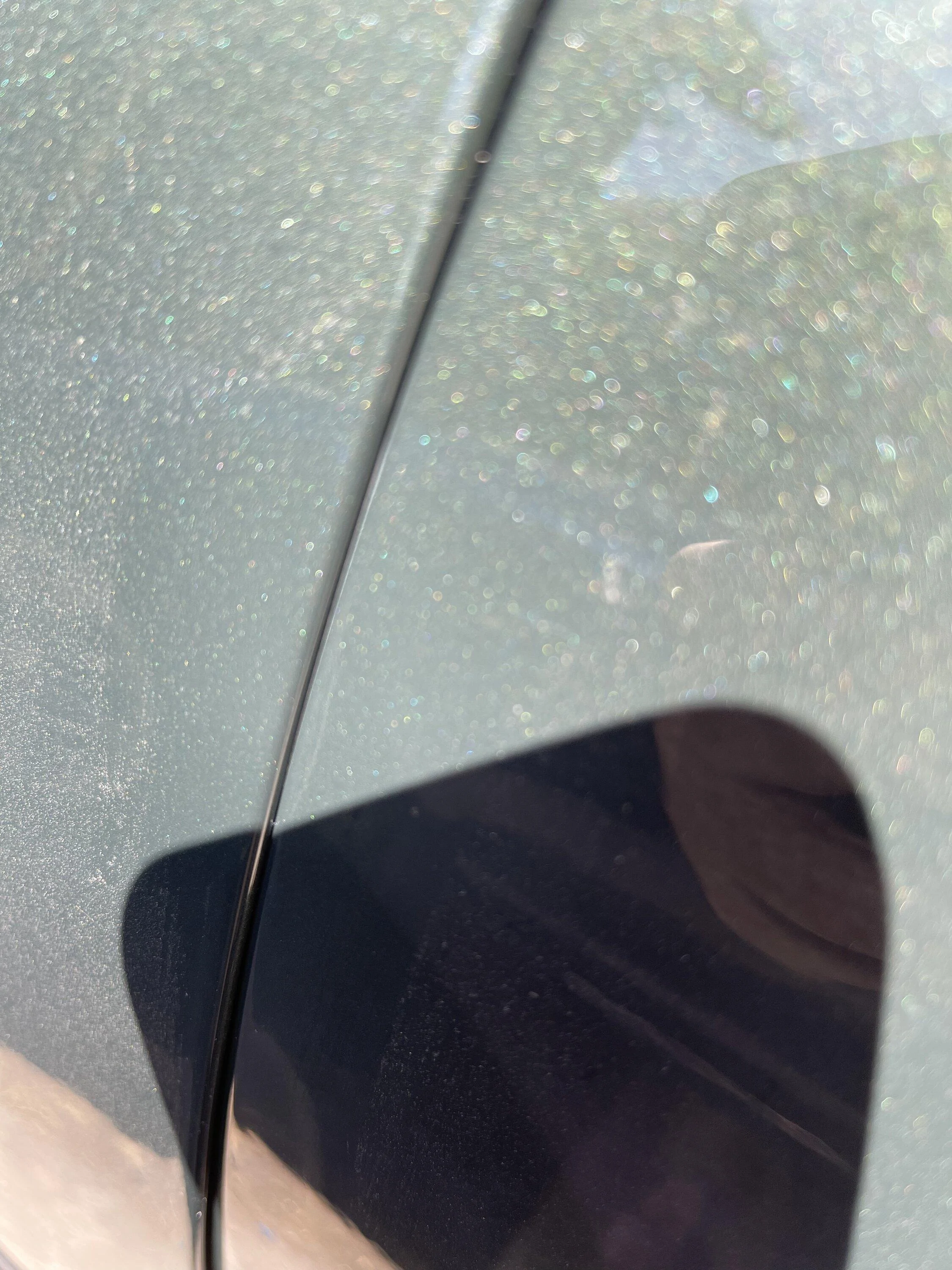 Rivian R1T R1S Driver side door rubbing, causing paint issues. B551894C-2900-4F7E-94C8-CEB3D0BA8E57