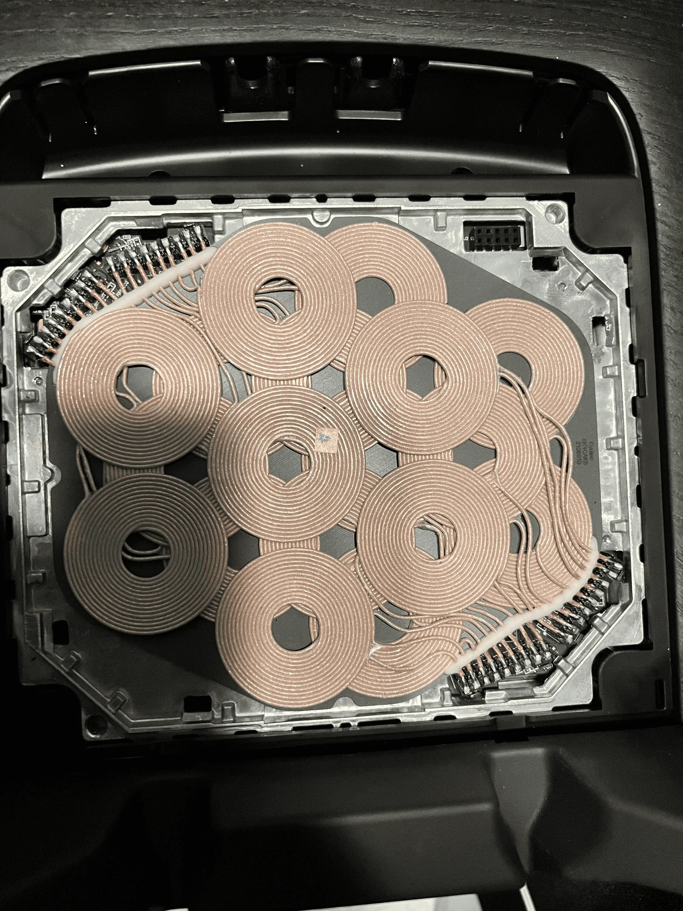 Rivian R1T R1S Wireless charging pad useless. Any changes imminent? 1659392710627