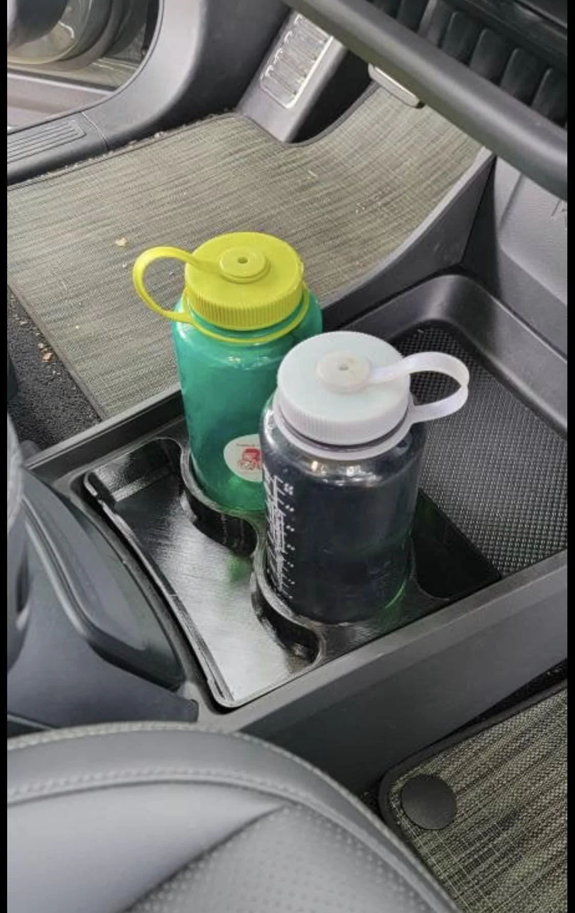 Rivian R1T R1S What reusable water bottle actually fits in the R1T/R1S? F9EF5EE0-FF21-45E0-8B66-4579613ED910