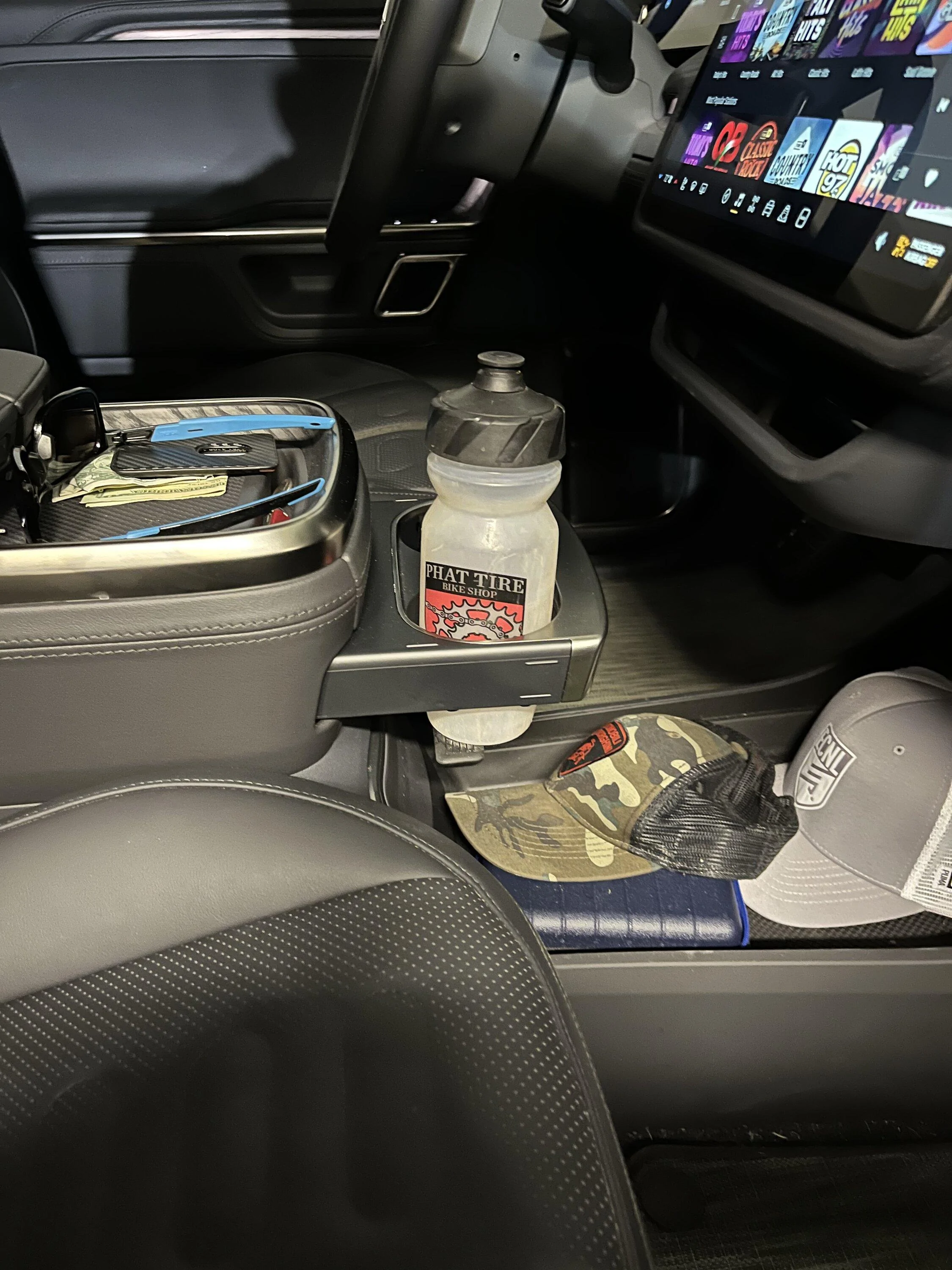 Rivian R1T R1S What reusable water bottle actually fits in the R1T/R1S? 2483D7C9-A6F9-457A-94A6-9D388E441560