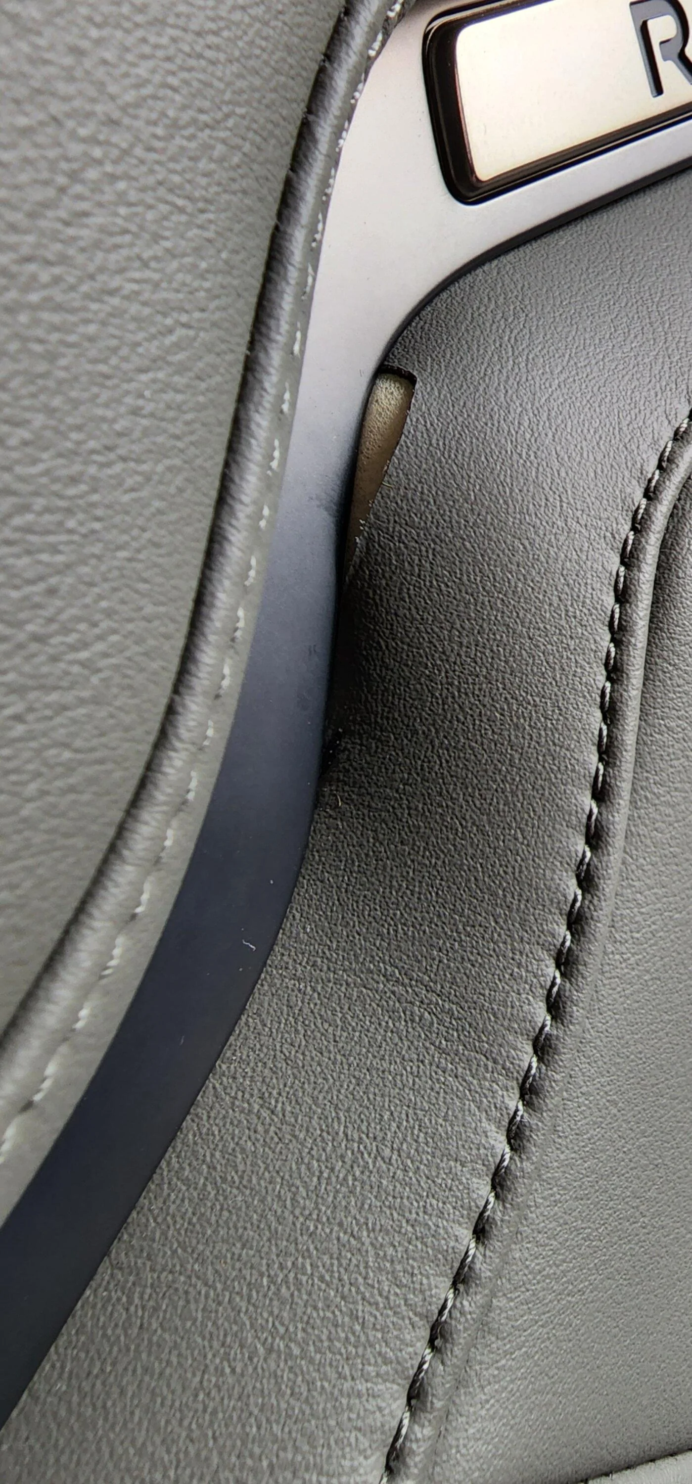 Rivian R1T R1S Driver's seat vinyl pulling out from divider, anybody else? Screenshot_20220819-153358_Gallery