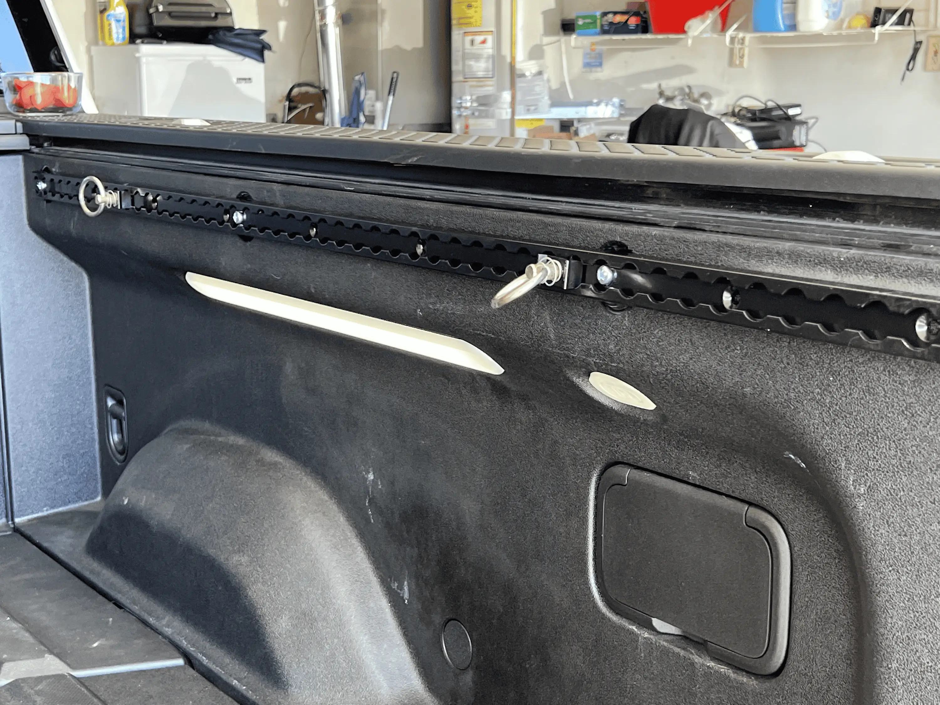 Rivian R1T R1S Installed S Track Tie Down Rails to Rivian R1T Bed tempImageymXAxv