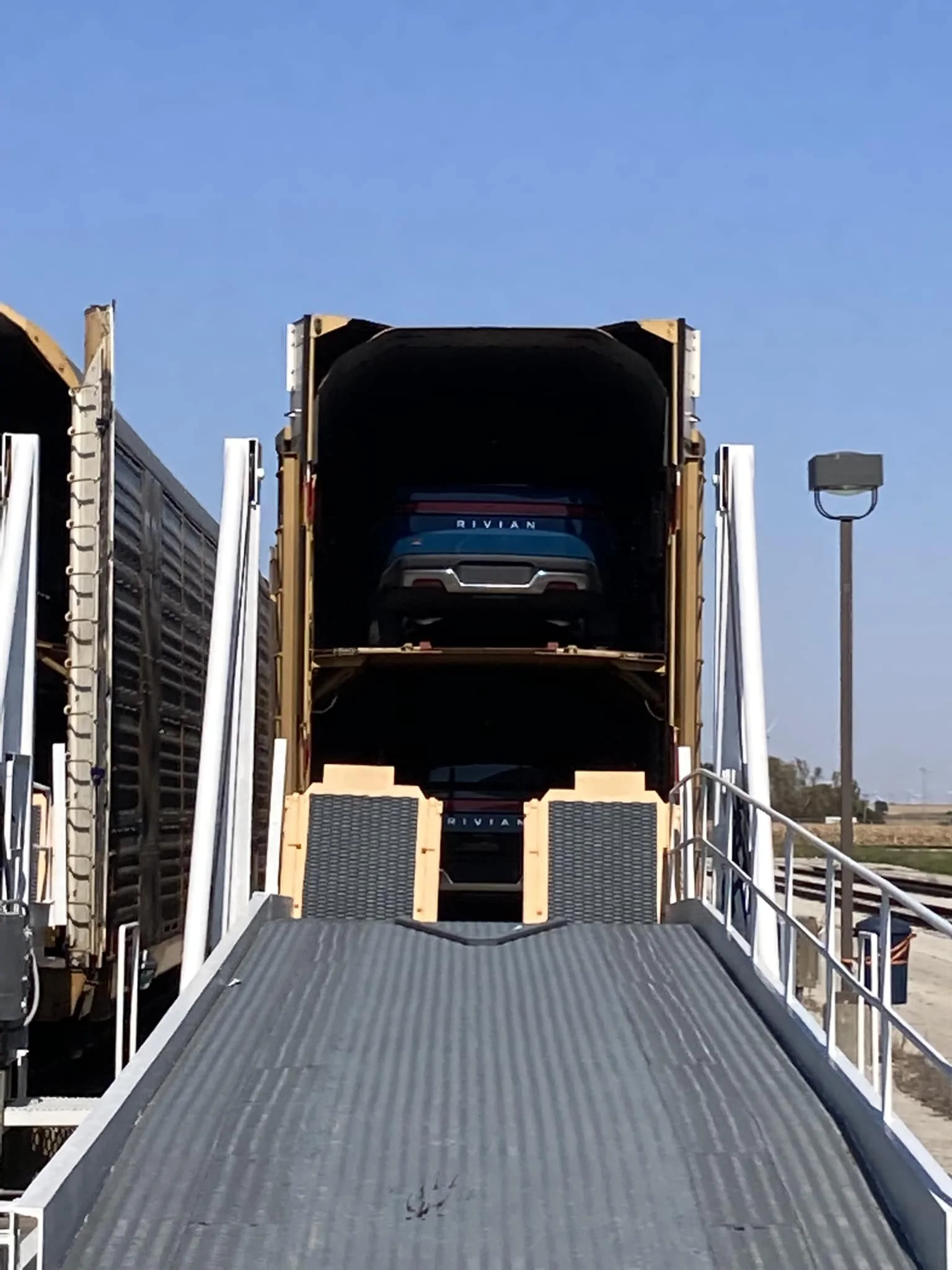 Rivian R1T R1S Rivians Loaded onto trains in Normal 1